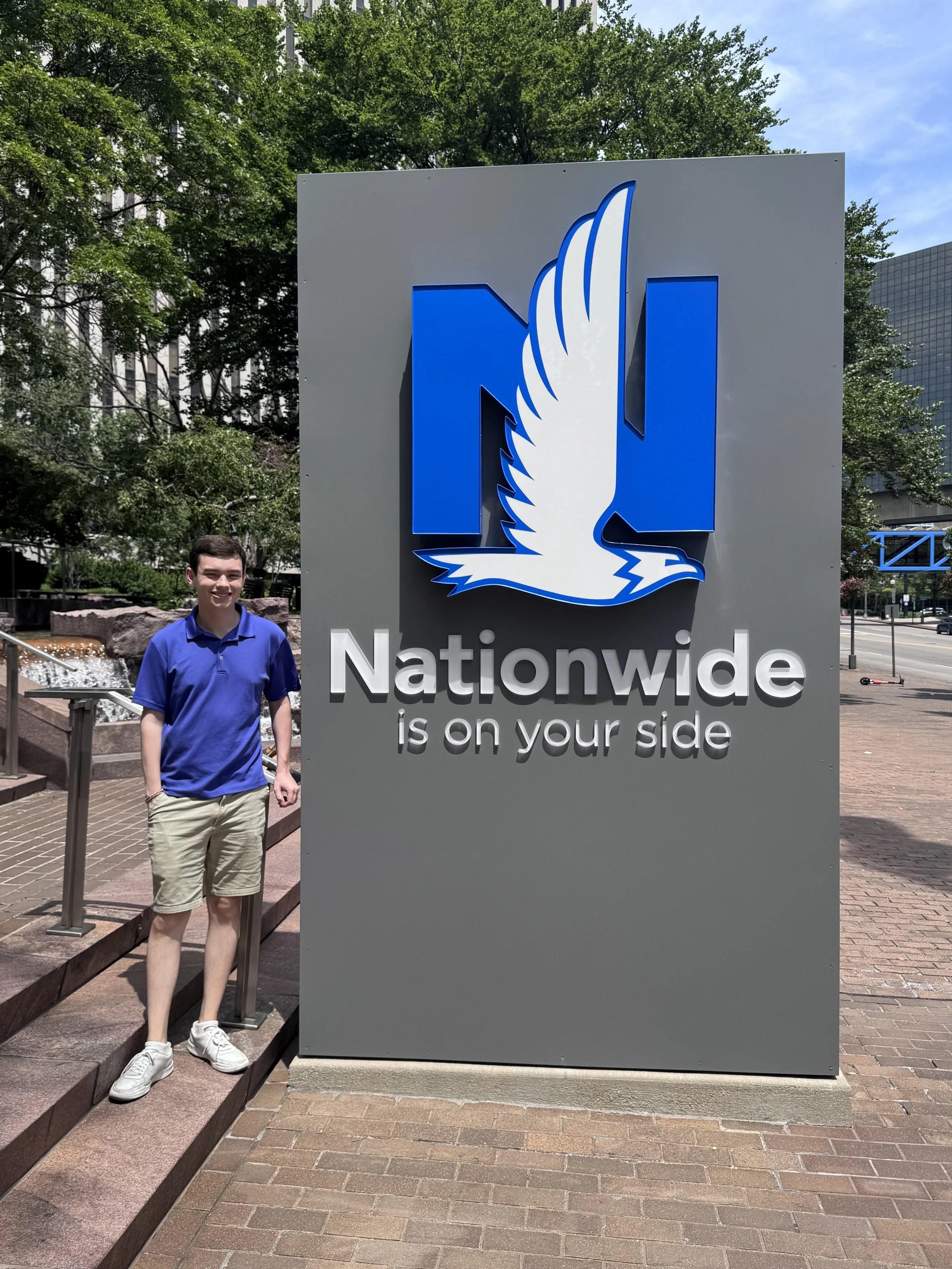 Matthew with Nationawide sign.jpeg