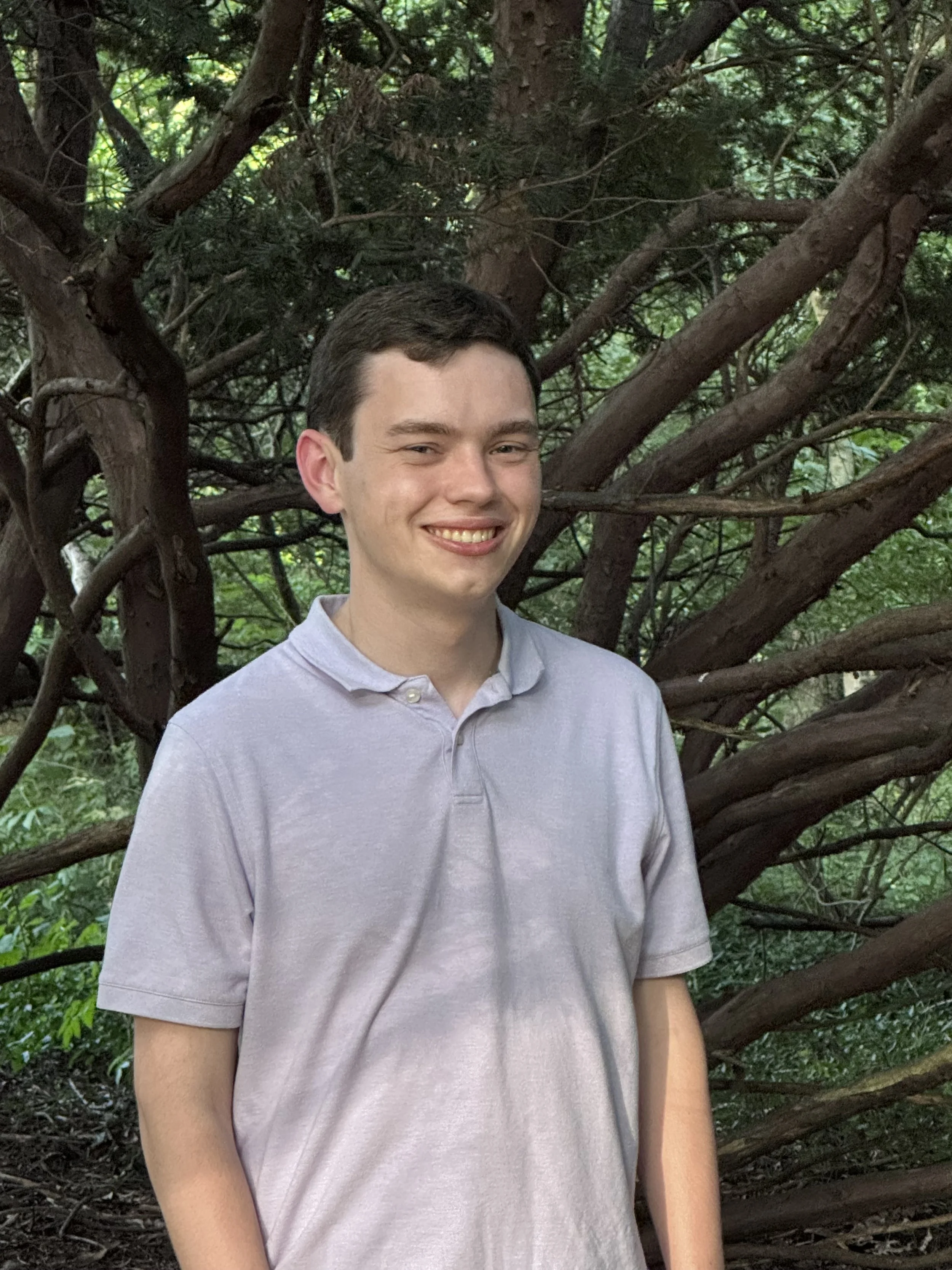 Matthew in front of bush.jpeg
