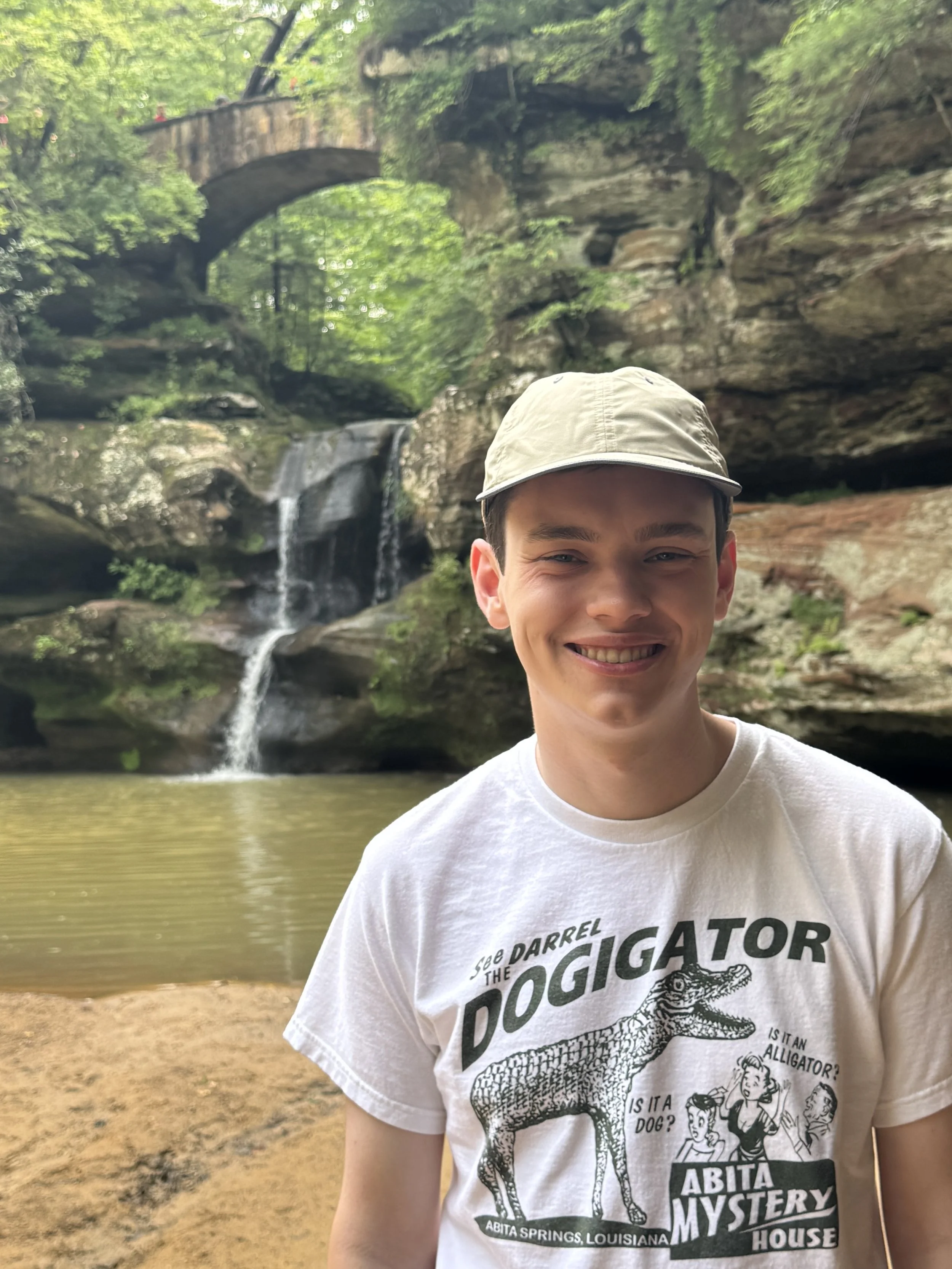 Matthew, funny tshirt, in front of waterfall.jpeg