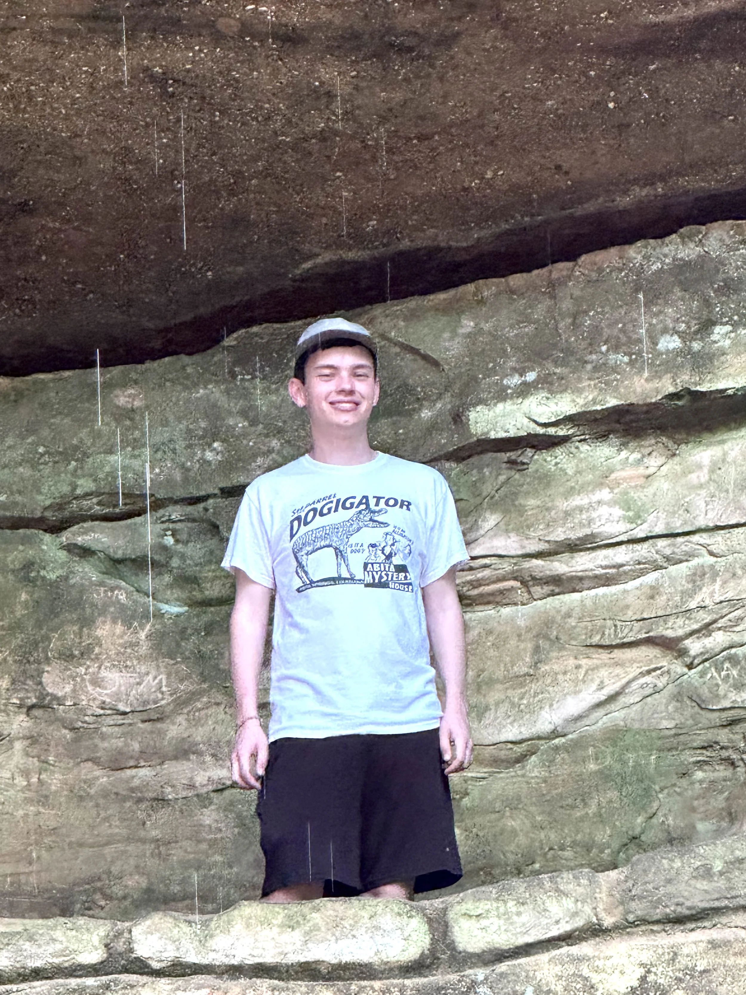 Matthew under rock outcropping.jpeg