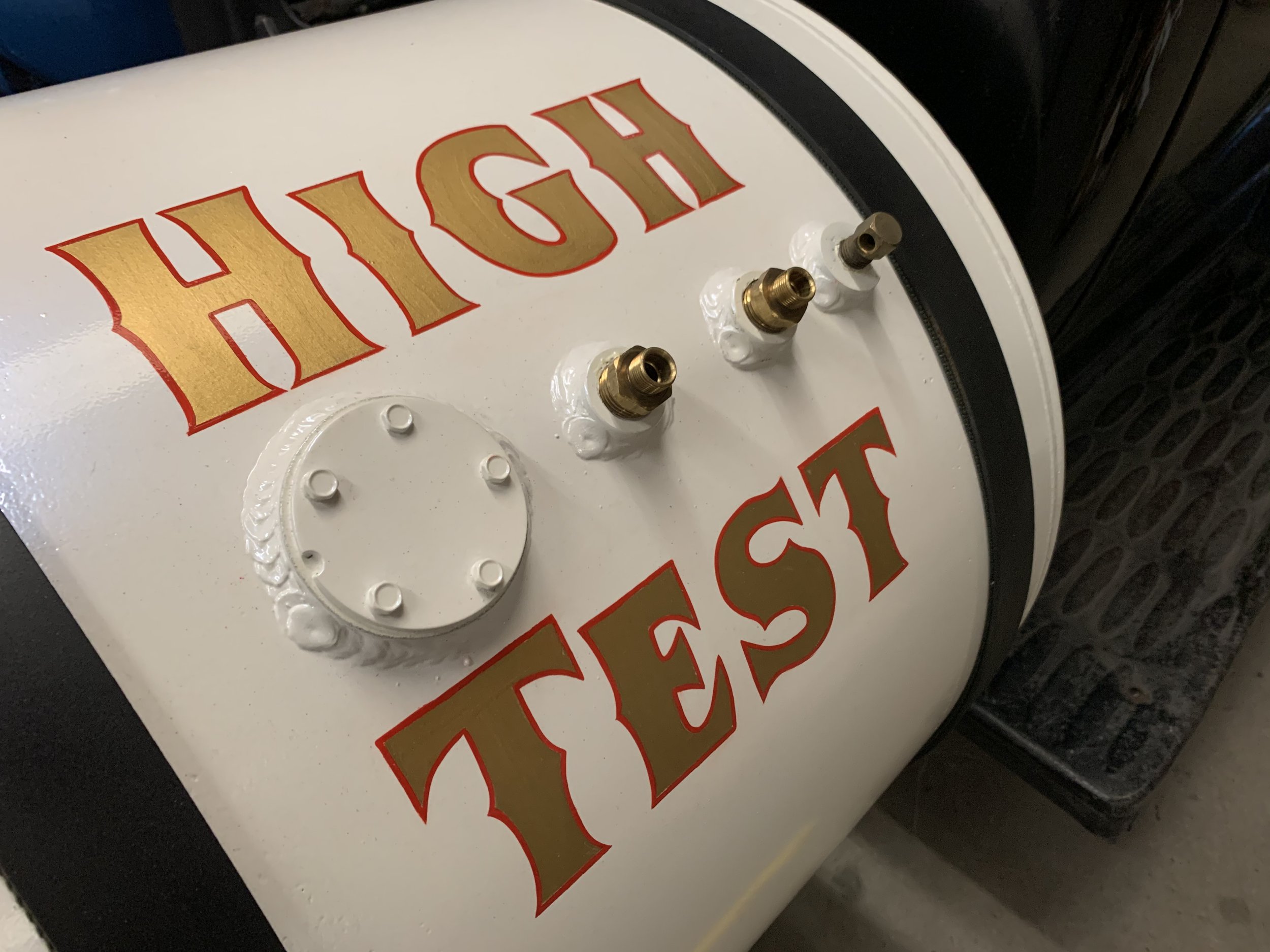 Hand lettering on fuel tank.