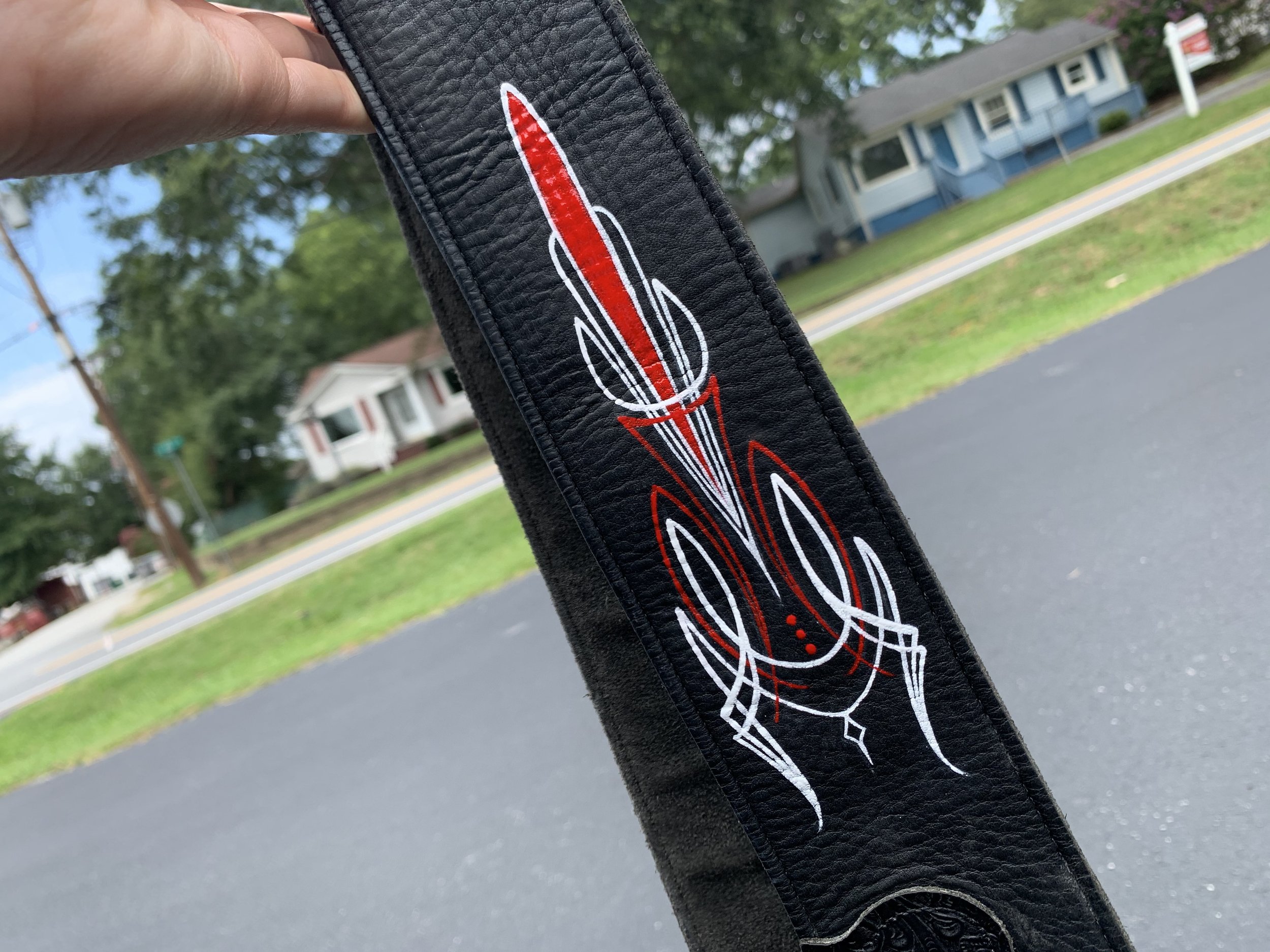 Pinstriped accents for guitar strap. 