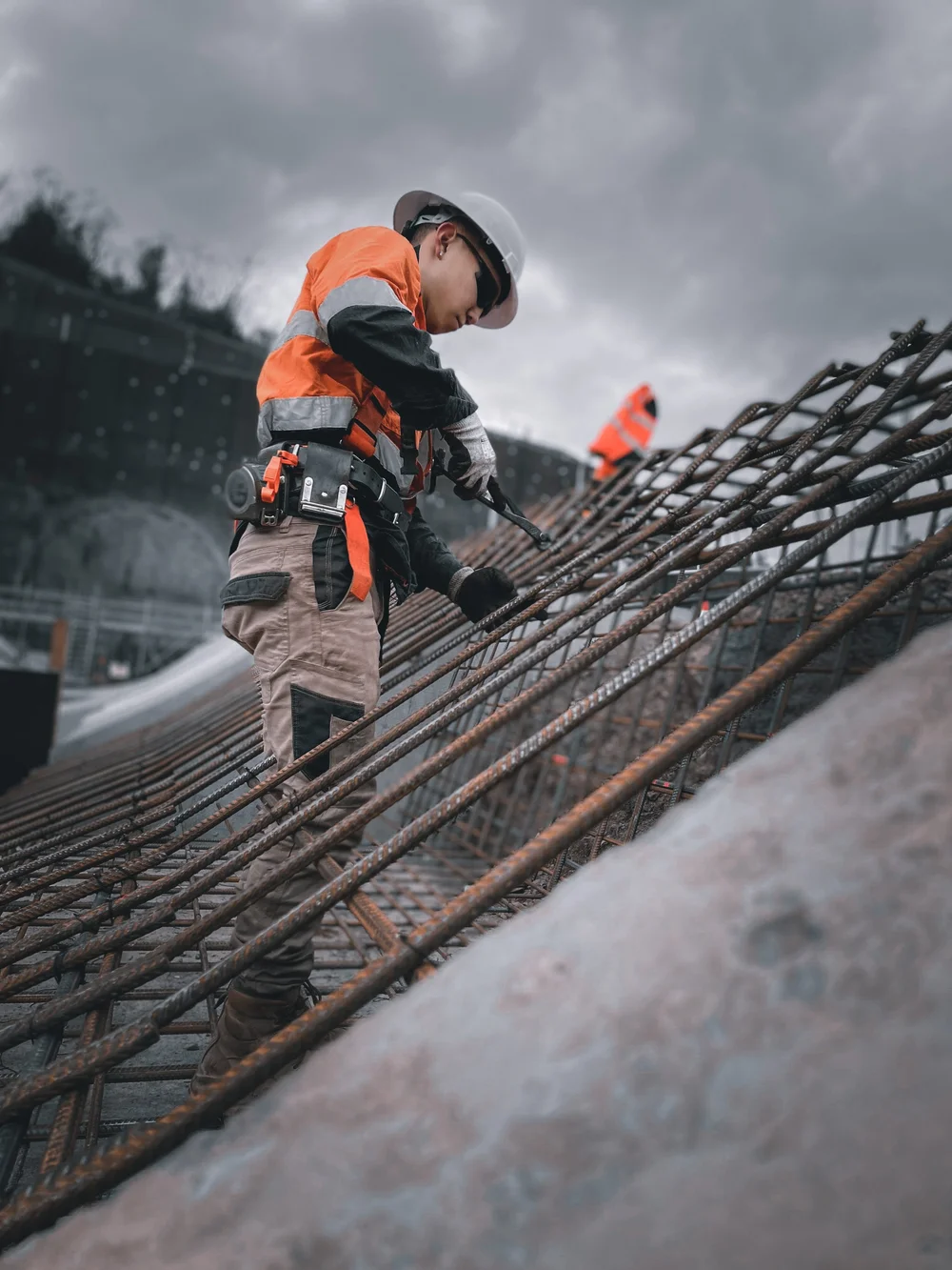 MJK steel fixer working across top reinforcement on a suspended slab