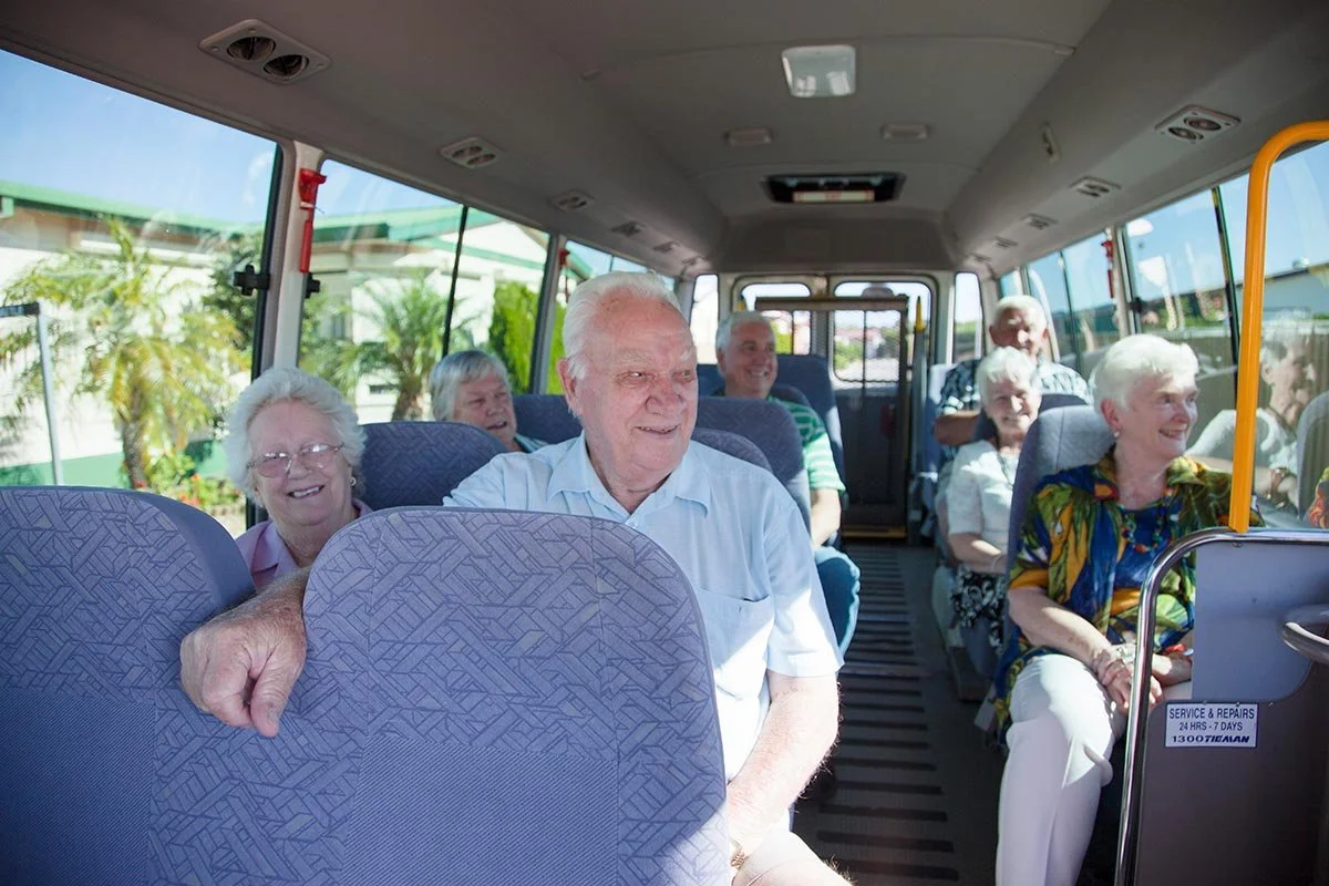 northern-community-residential-village-residents-riding-coaster-bus.jpg