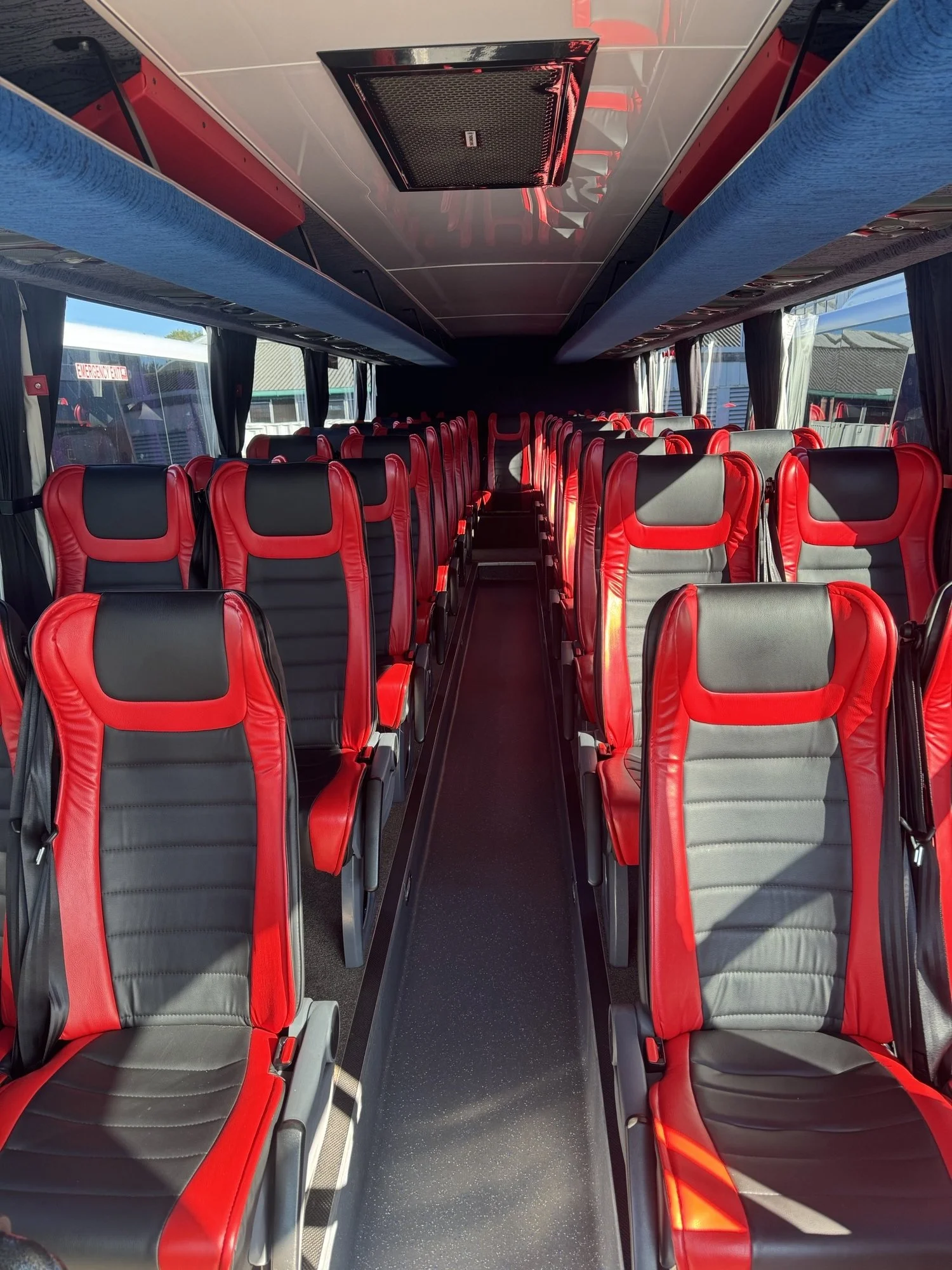 Premium leather seat luxury coach available for Auckland corporate transport and nationwide executive charter services.