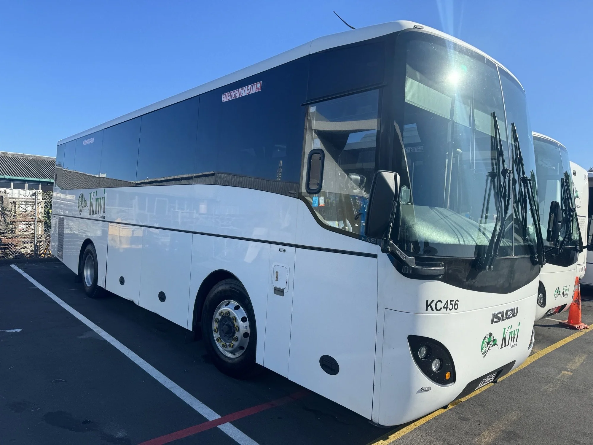 37 seat luxury touring coach with extra legroom and panoramic windows for NZ wide tour groups.