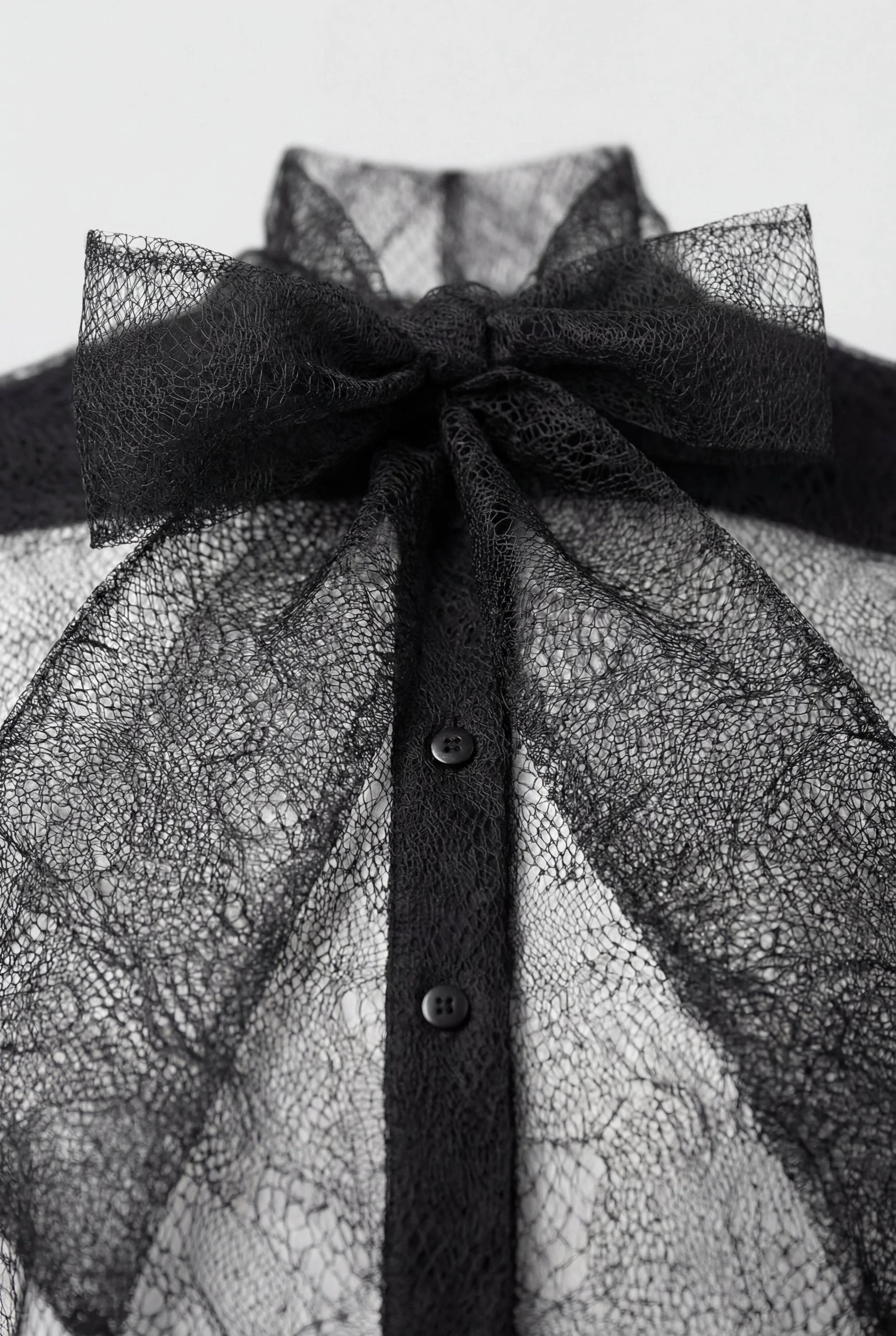 Detail of OBADIA Diane Shirt in black patchwork lace with Lavallière neck tie