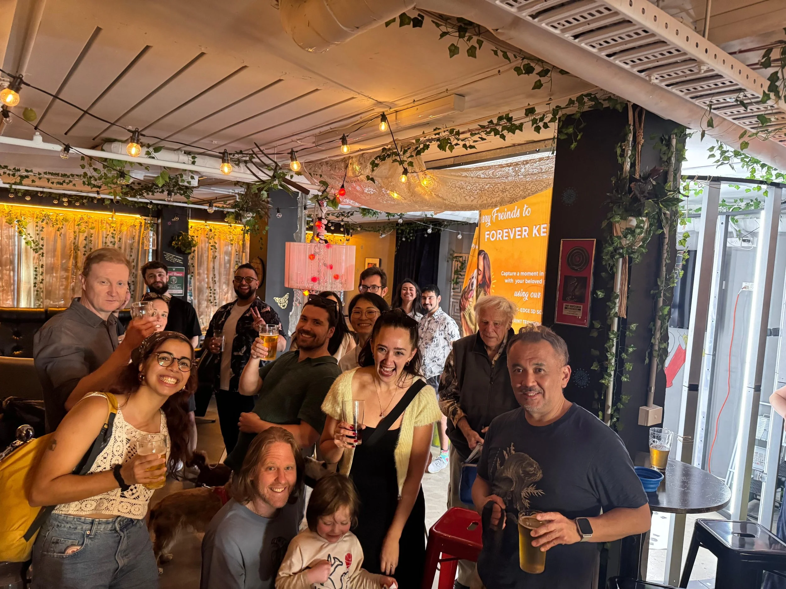 Pawshare Club Event with lots of happy people huddling around.