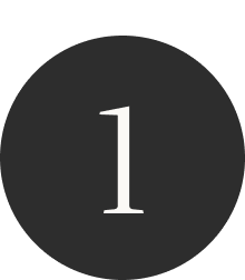 A black circular sign with a white number 1 in the center.