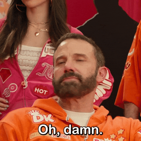 Gif of Ben Affleck saying "oh damn" wearing an outfit sponsored by Dunkin Donuts from the commercian, "good will dunkin"