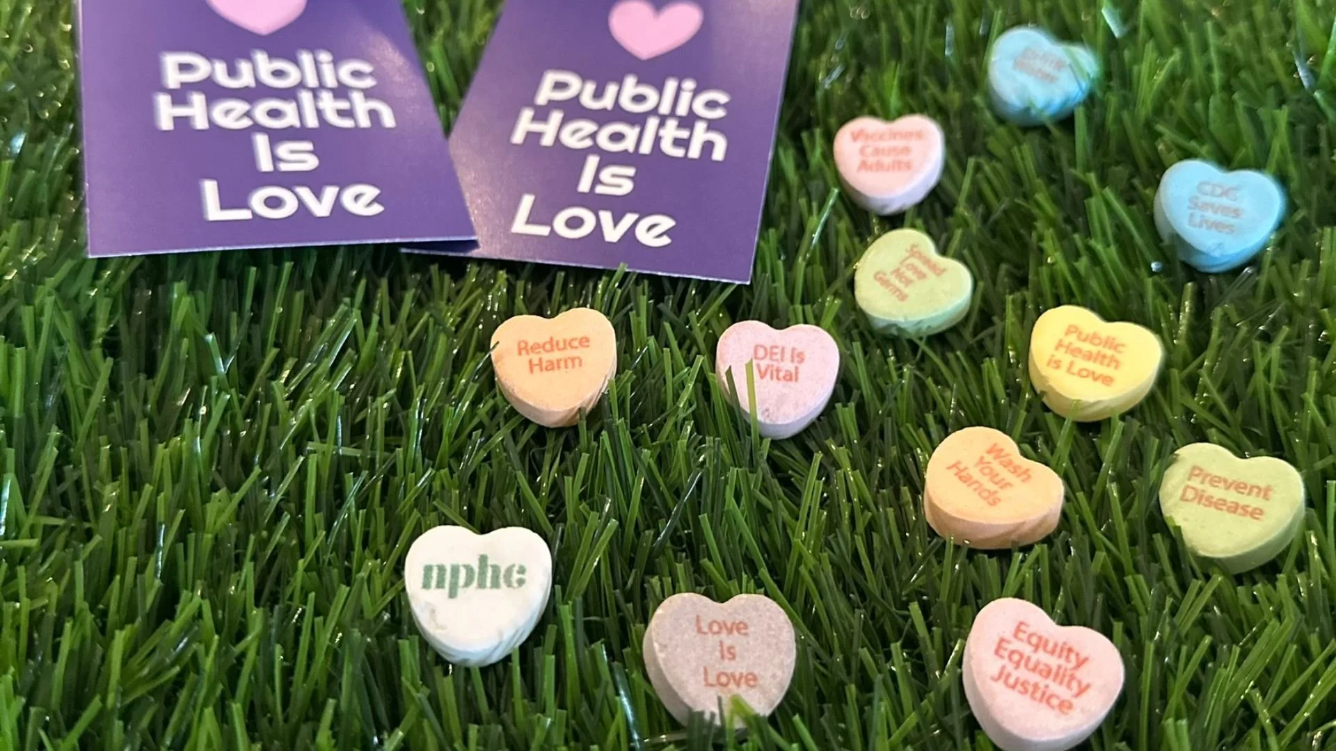 various Fired But Fighting merchandise, including new products like NPHC Valentine’s Day candy hearts