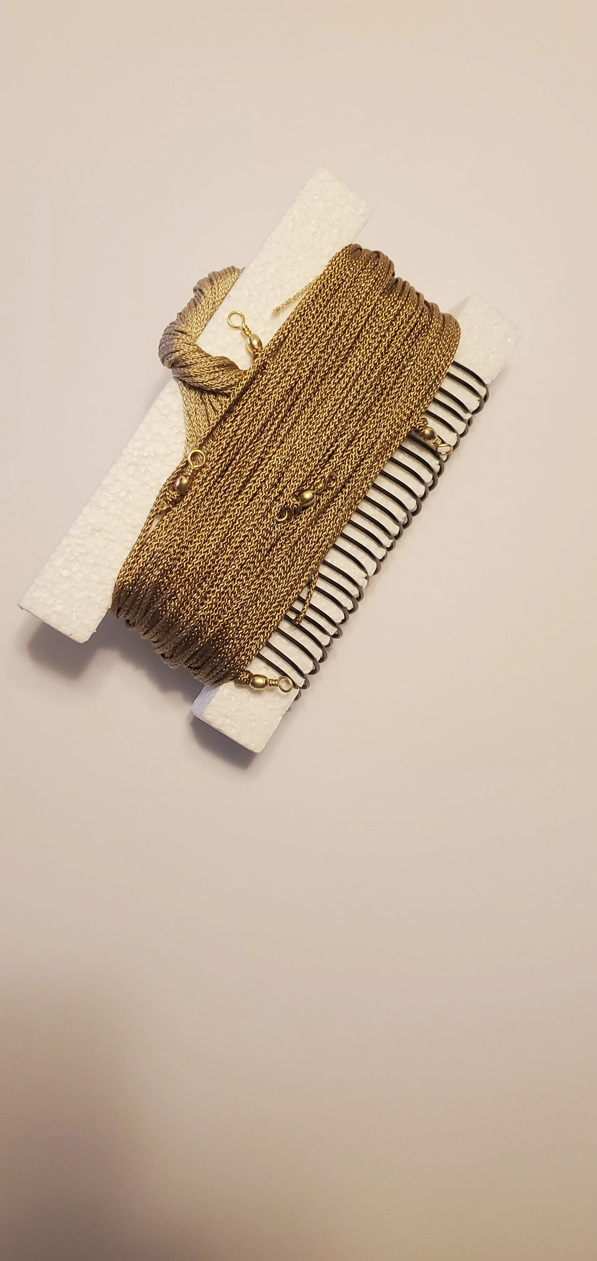 A tan string trotline on styrofoam