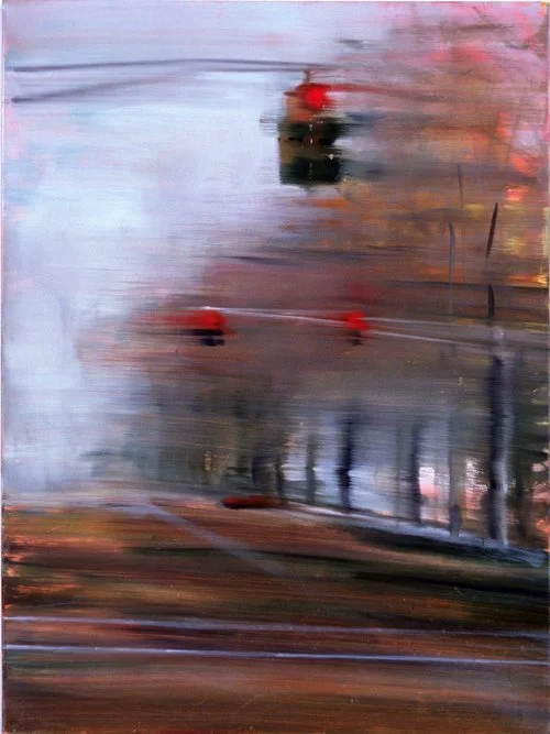 Abstract painting resembling a blurred cityscape with red and dark accents.