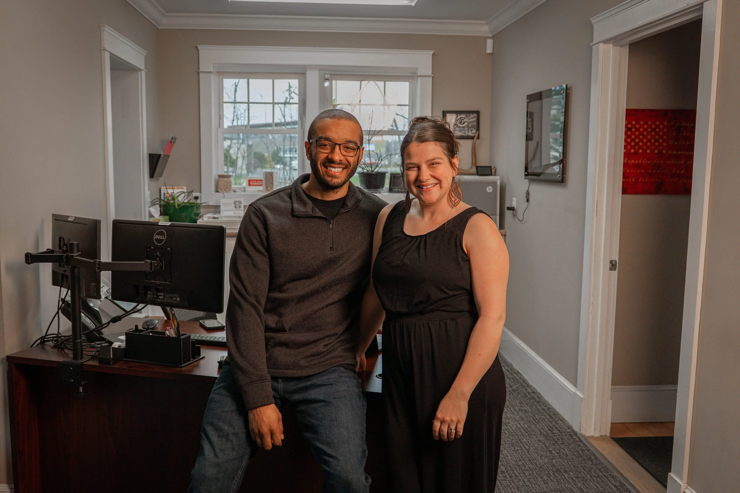 Desmond and Siena Haskell, co-founders of Haskell Digital Services, working together in their Central Maine office.