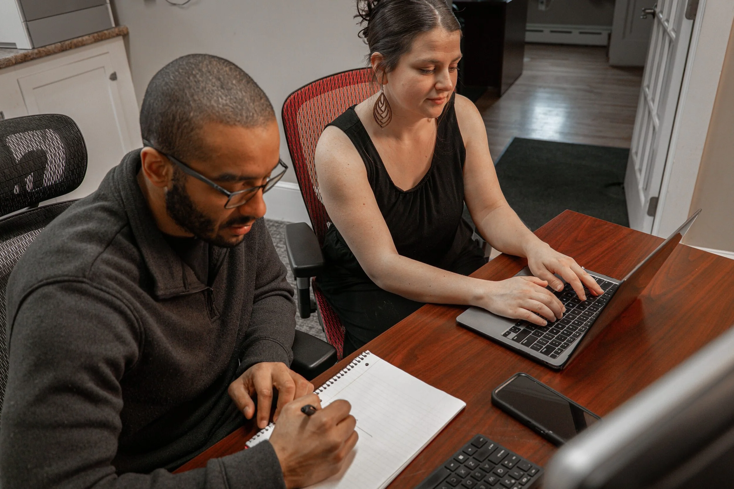 Desmond and Siena Haskell working together on a small-business website project.