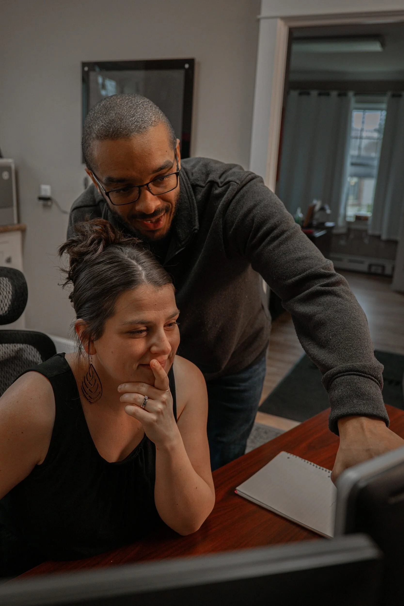 Desmond and Siena Haskell reviewing project notes together.