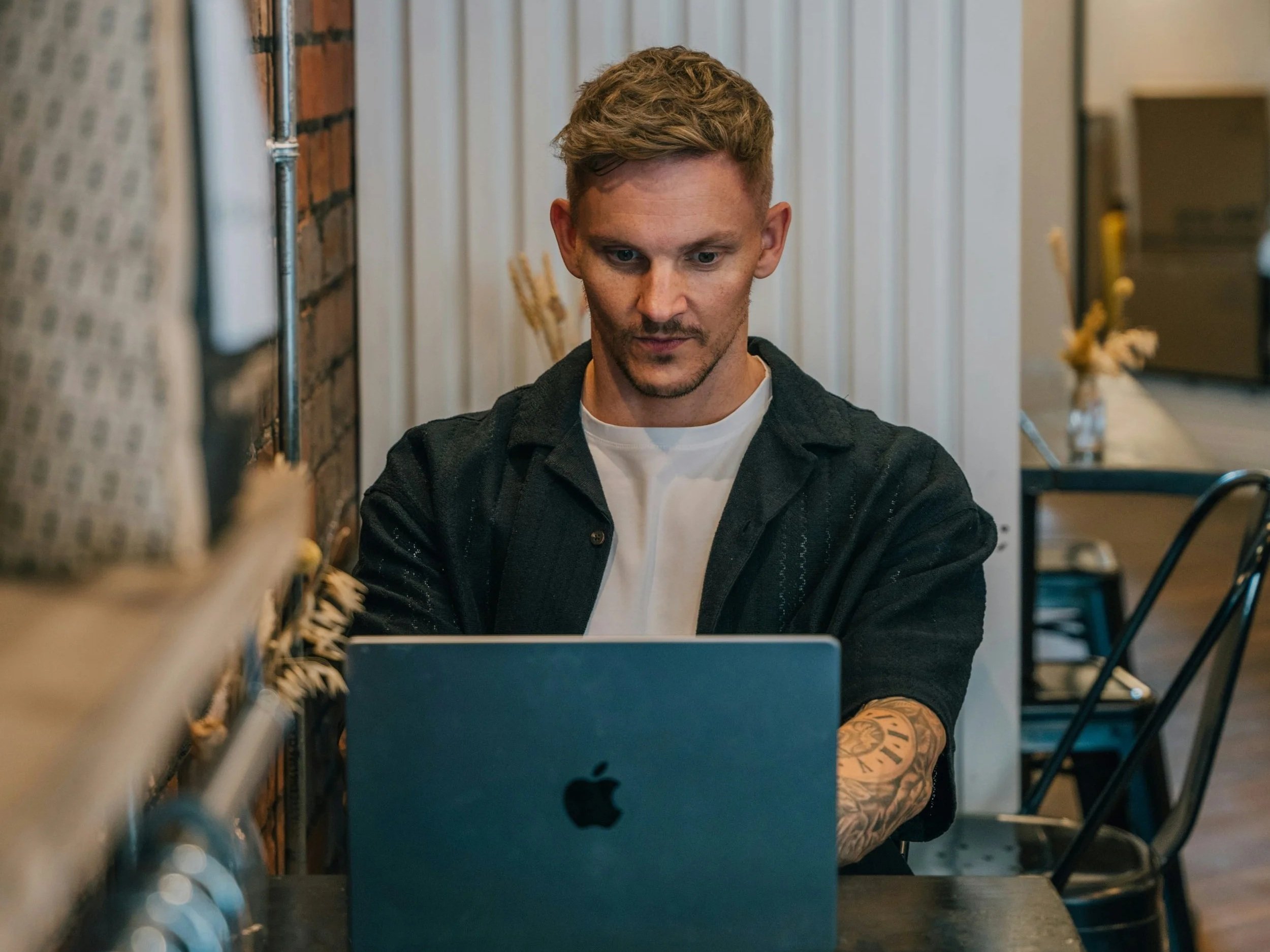 Small business owner working on a laptop in a quiet workspace