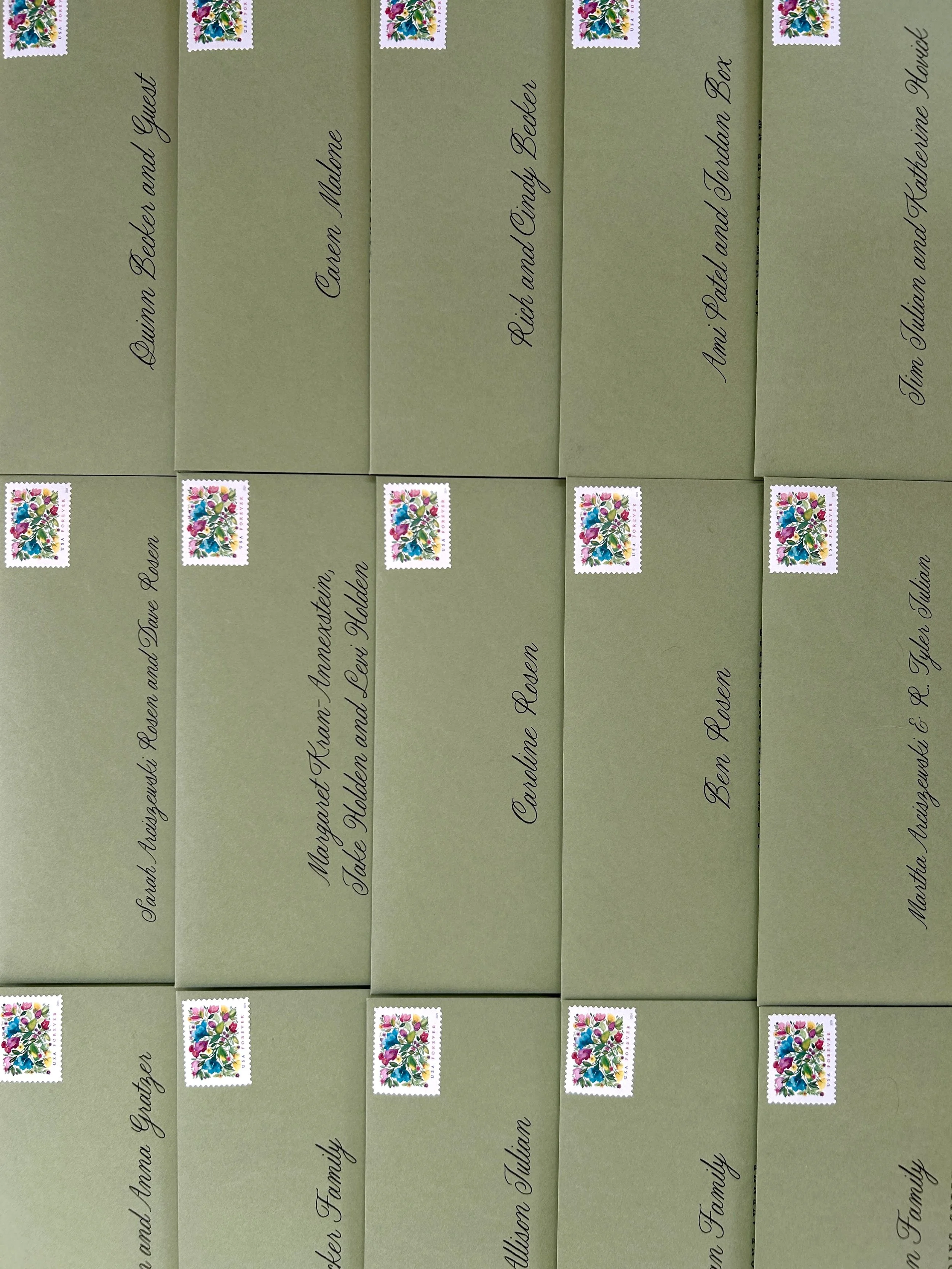 Finished wedding invitation envelopes addressed and prepared with postage