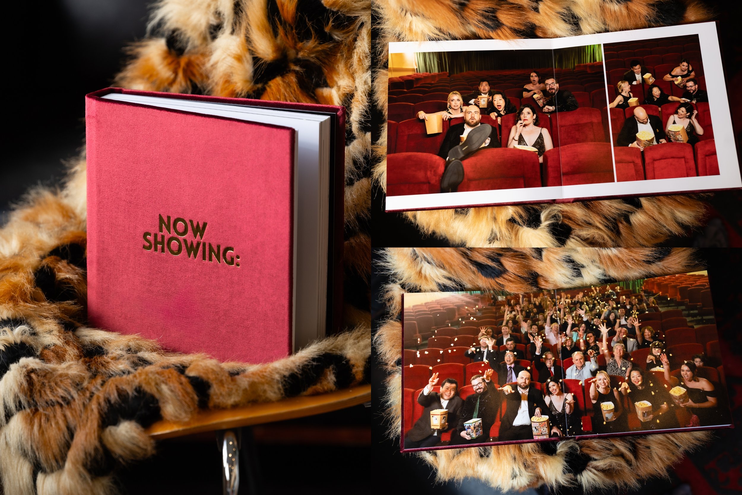 Open photo album with images of a theatre audience, a red velvet curtain, and a sign that says 'Now Showing' on a pink background. The album rests on a leopard print fabric.