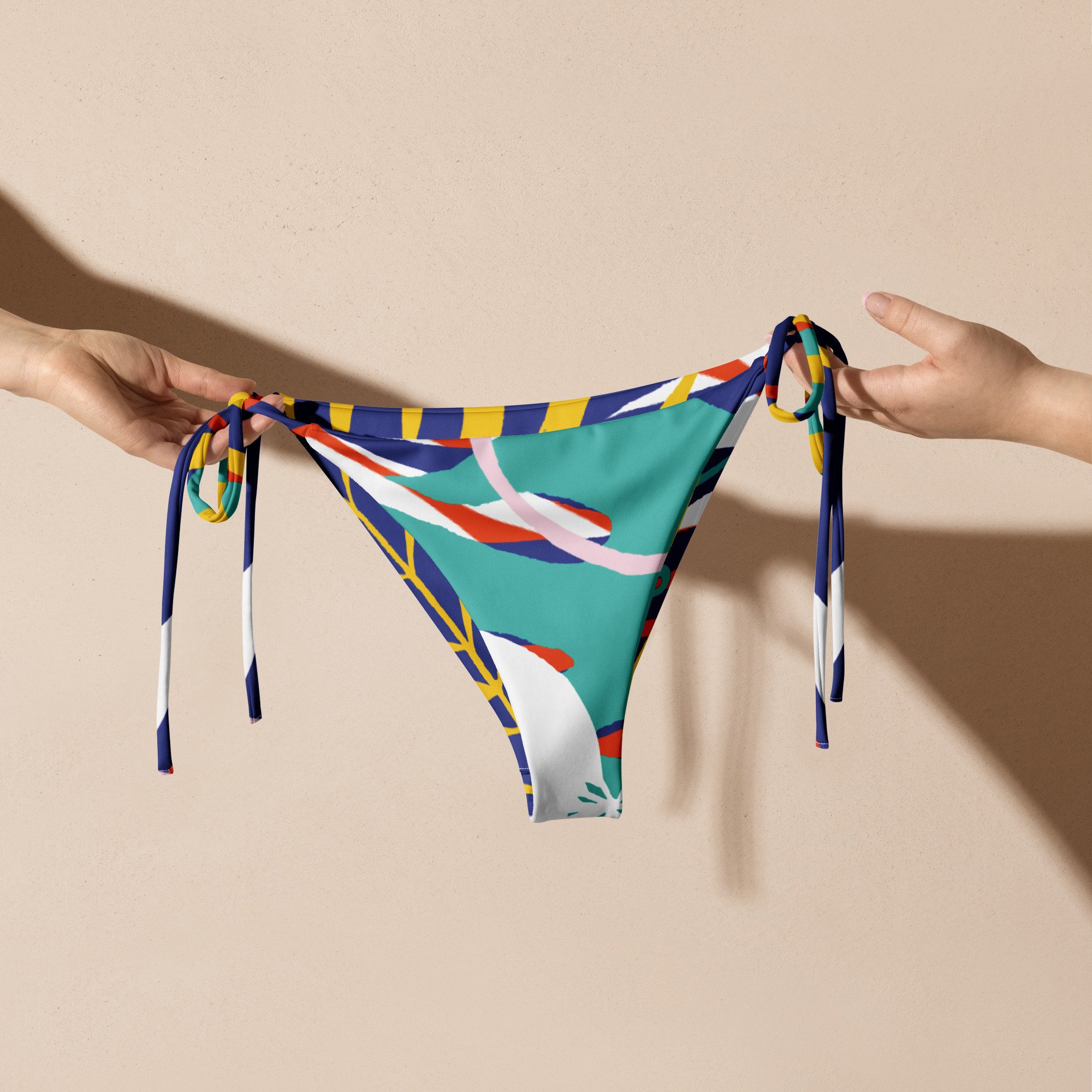all-over-print-recycled-string-bikini-bottom-white-front-68222b2db6326.jpg