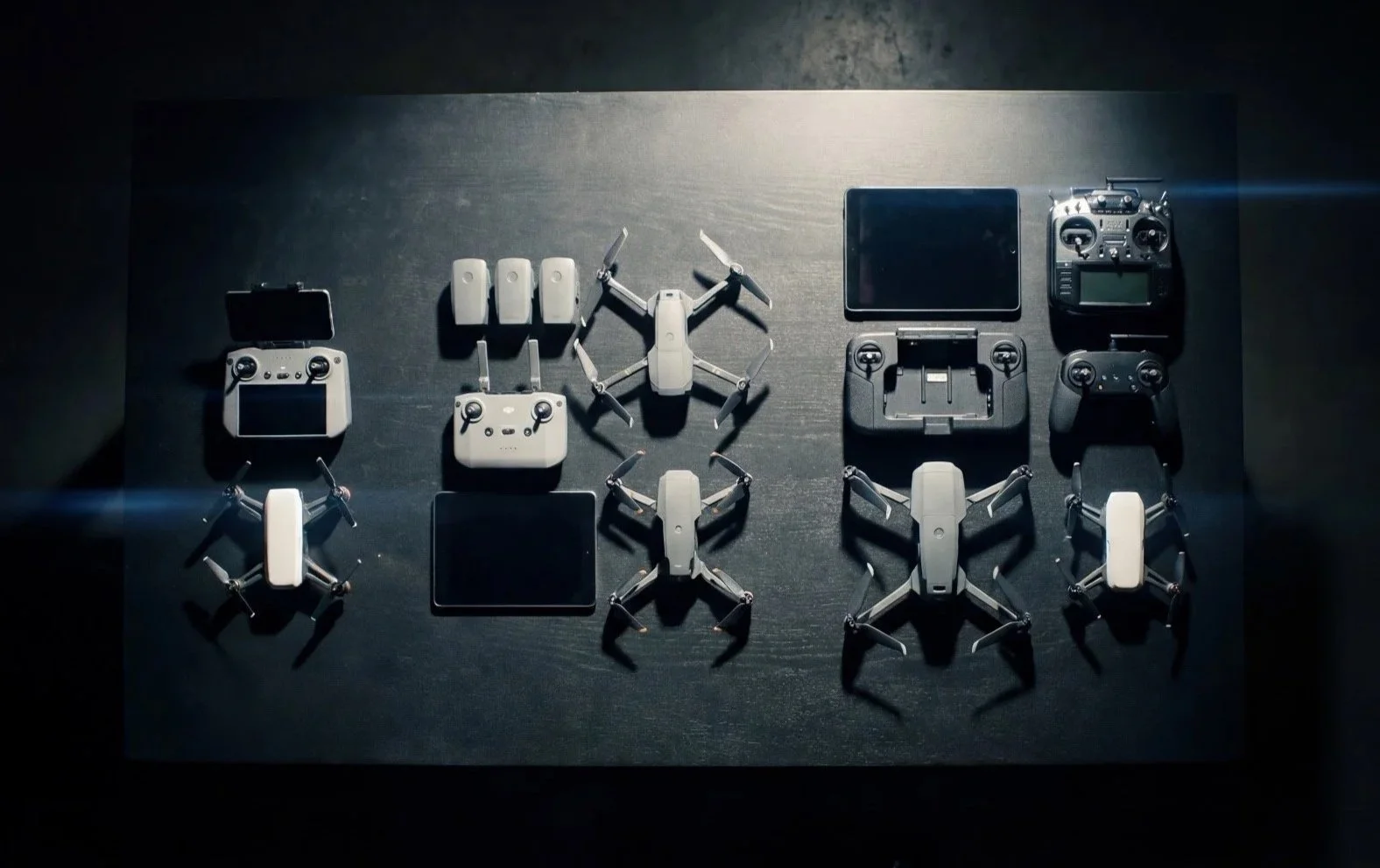 A flat lay of drone platforms and controllers representing different levels of a public safety drone program.