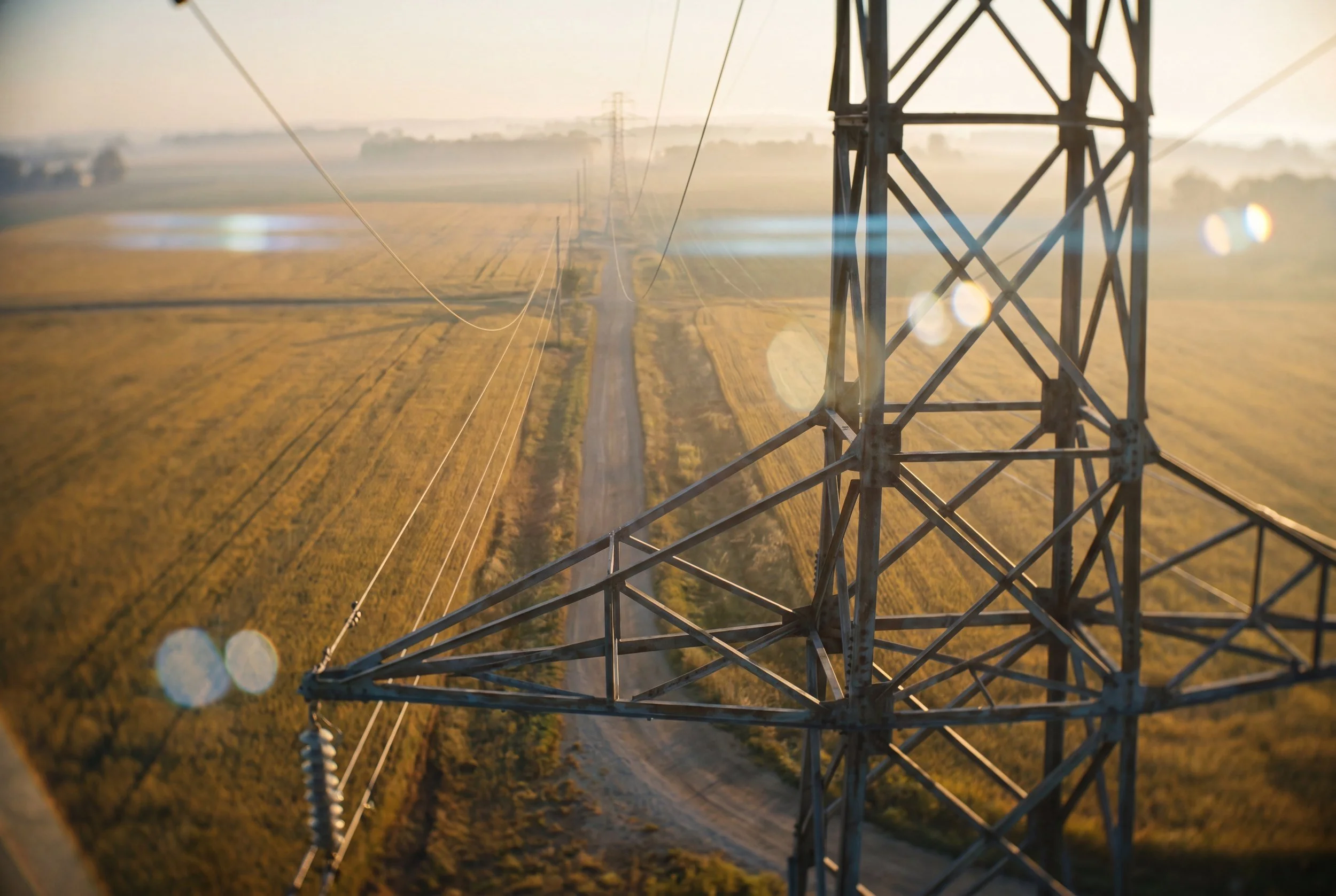 Aerial drone view over utility right-of-way at sunrise