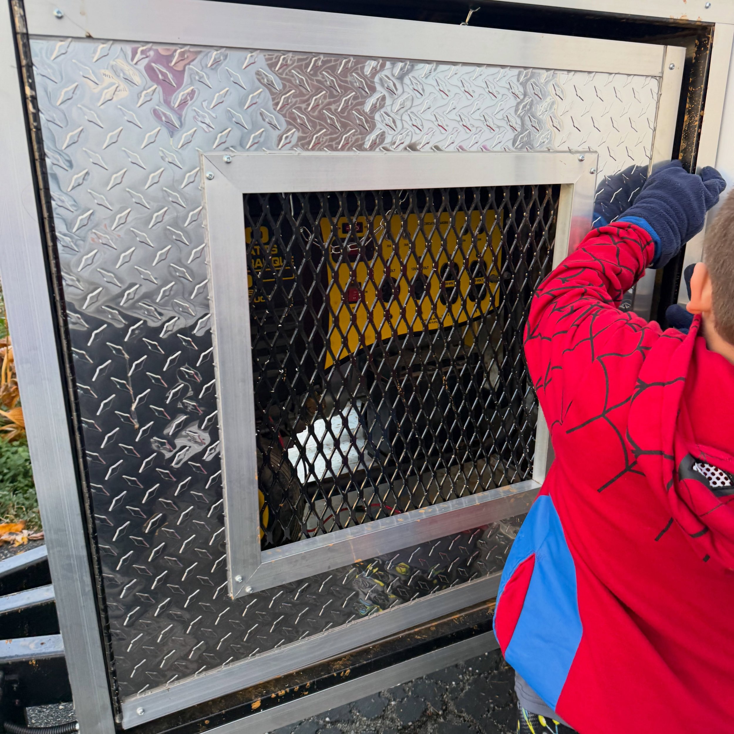 Trailer Update: We got our generator with the help of our friendly neighborhood hero Spider Man. 

Our next steps is a small decal with our logo until we can raise the money to wrap the whole trailer. 

Know any good places to get a quote for a full 