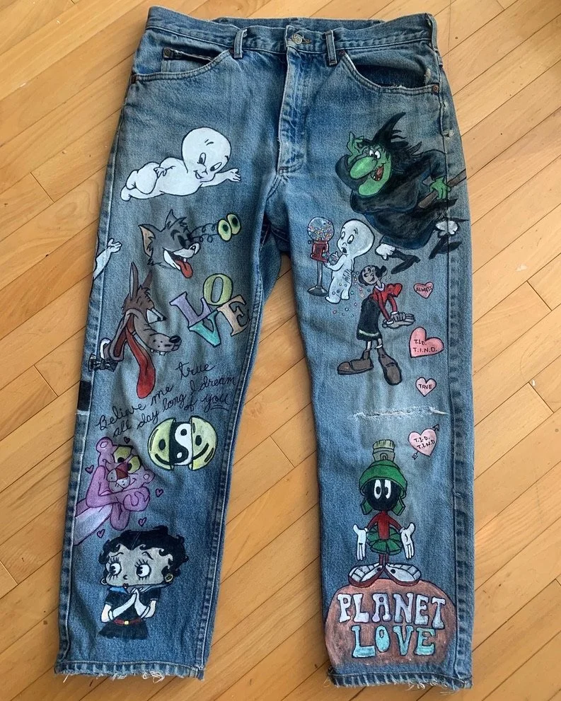Hand drawn and painted cartoons on denim