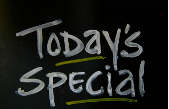Chalkboard sign with the words "Today's Special" written in white with green underlines.