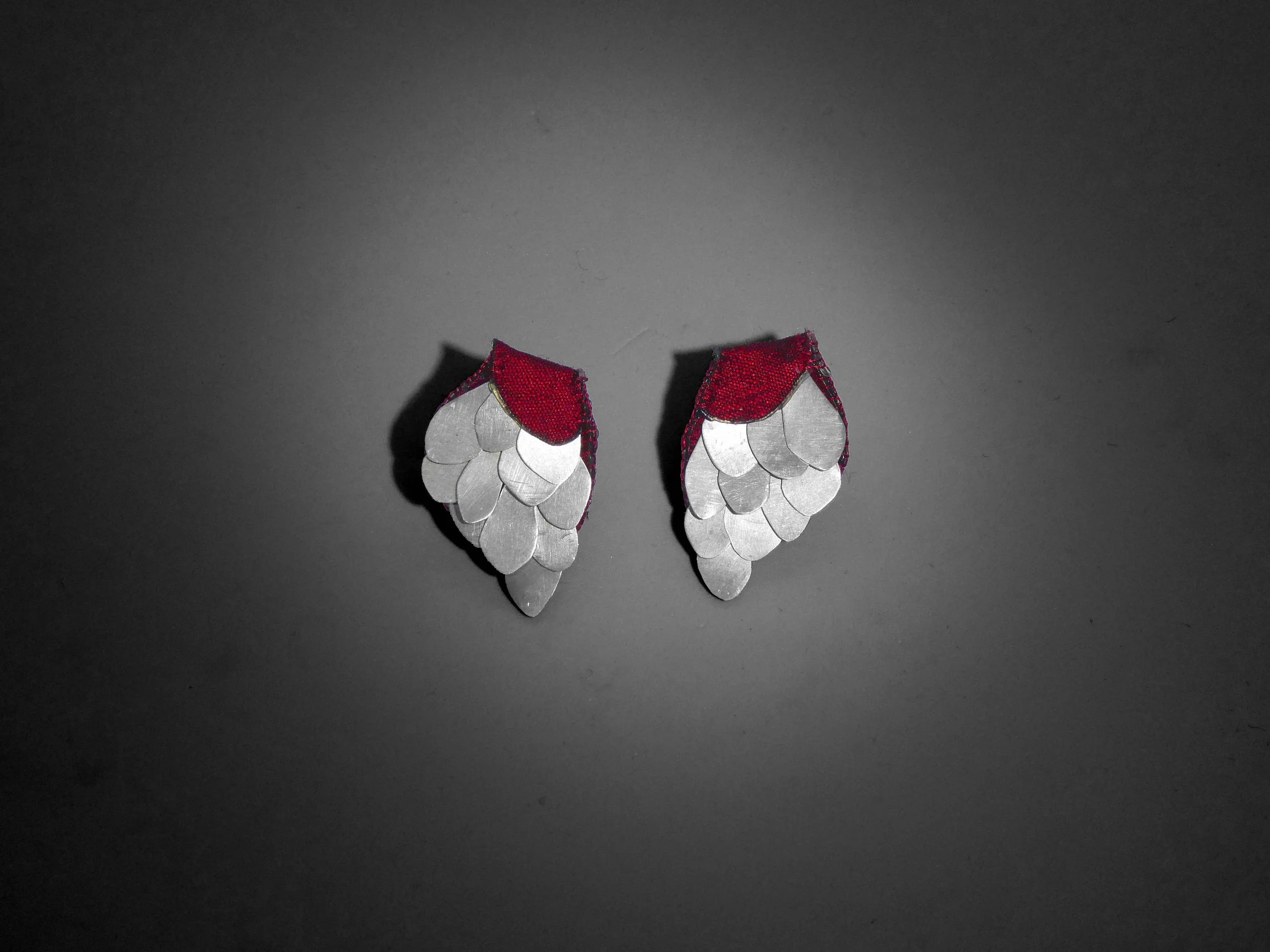 Silver and silk earrings with raw silk backdrop