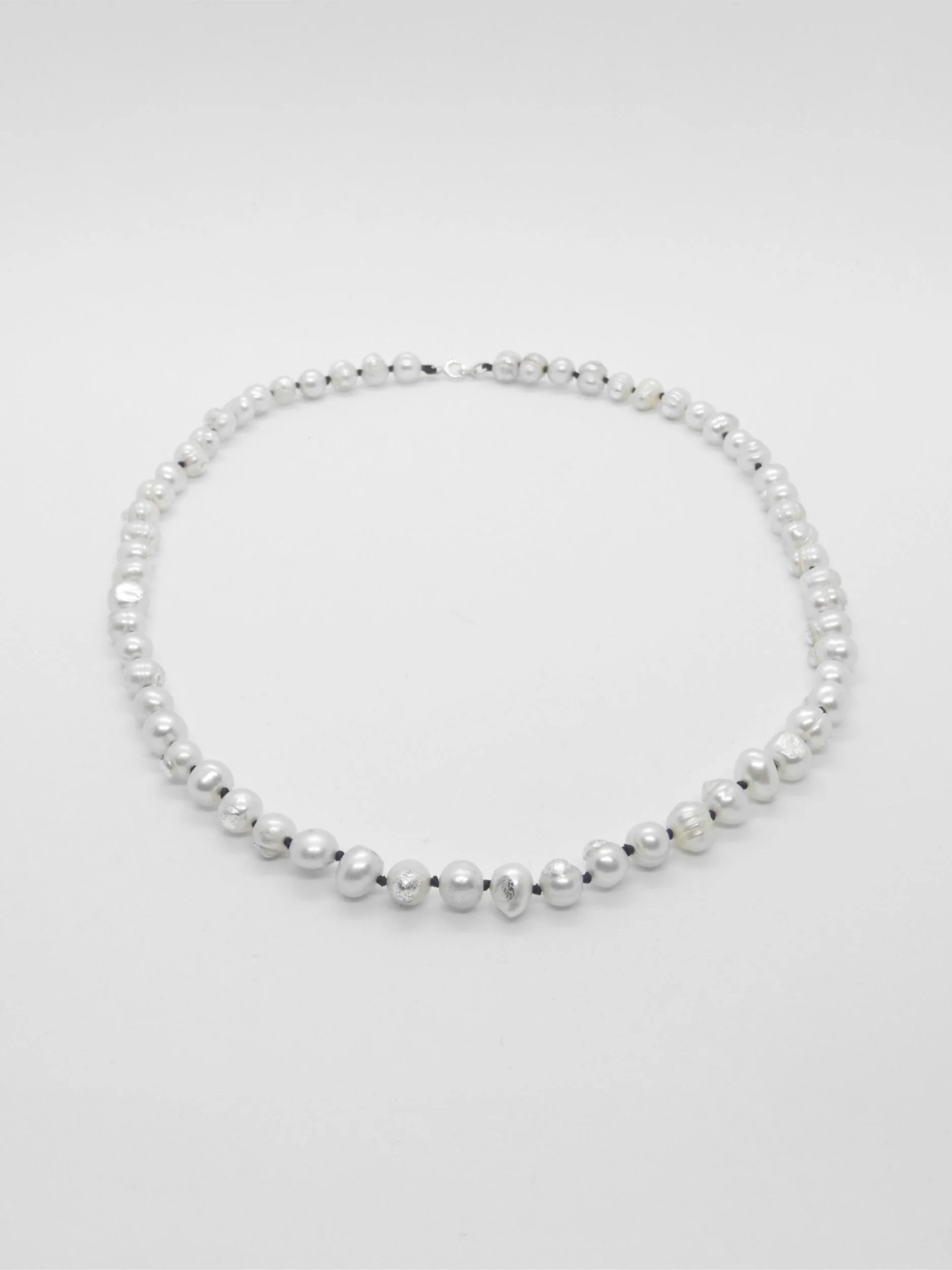 Gilded pearls: pearls, silver leaf