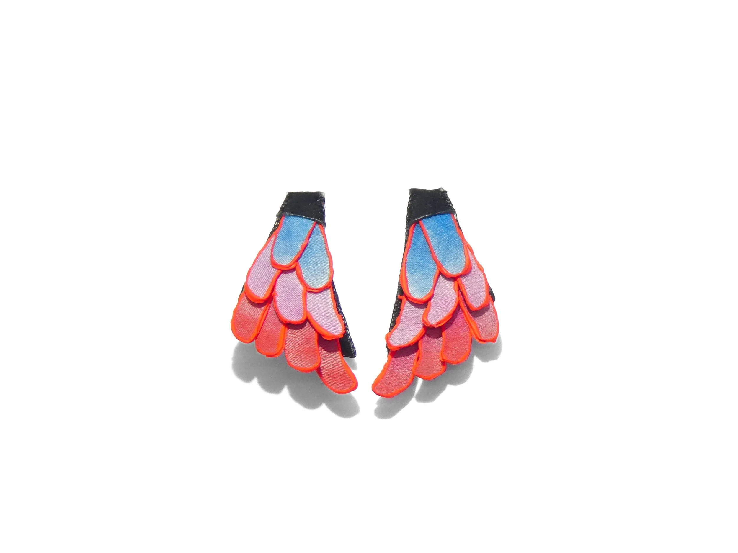 Art jewelry piece by Julie Usel, iridescent pink and blue tones, handmade in Switzerland