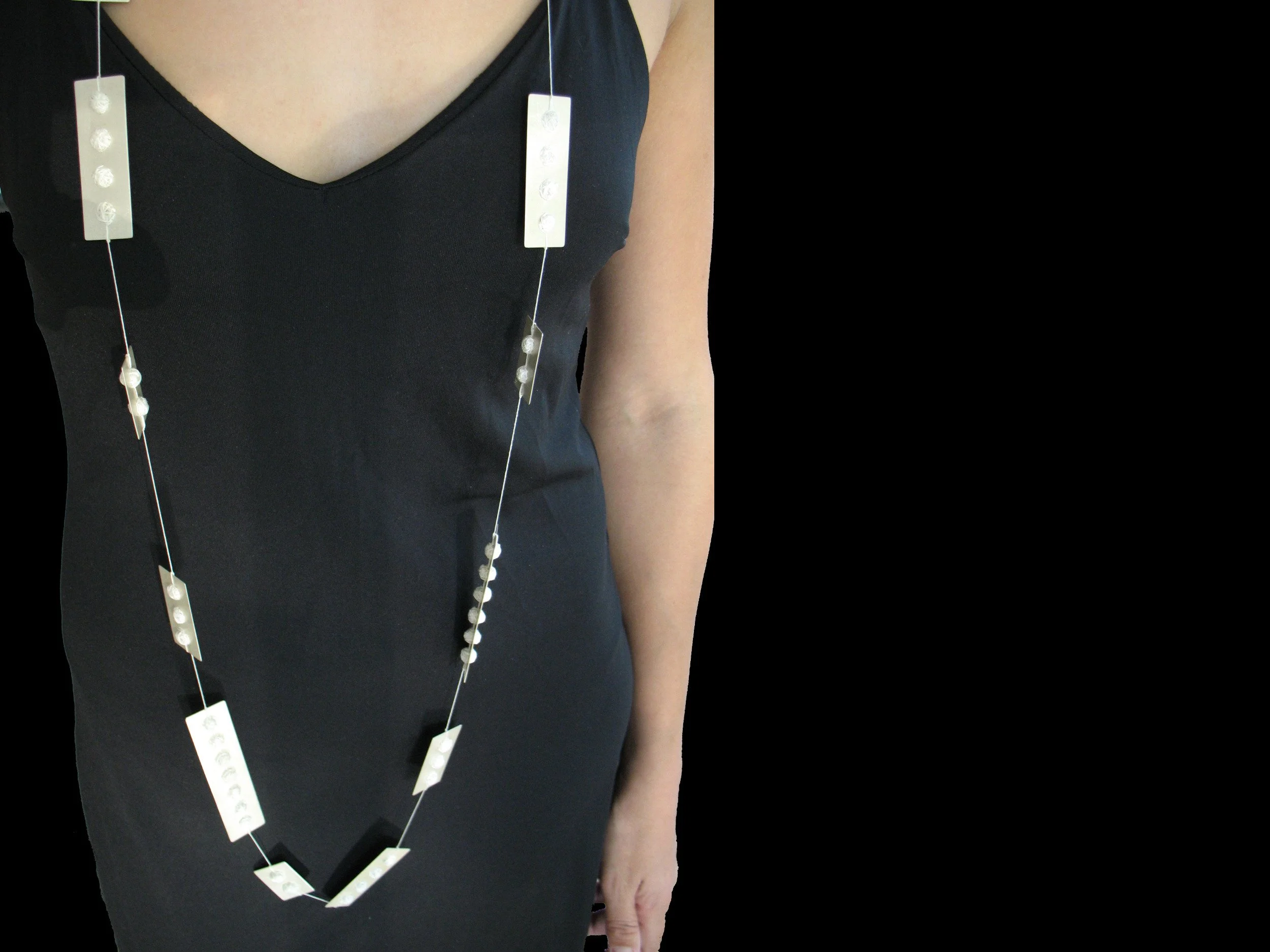 Plaquettes, silver and silk thread