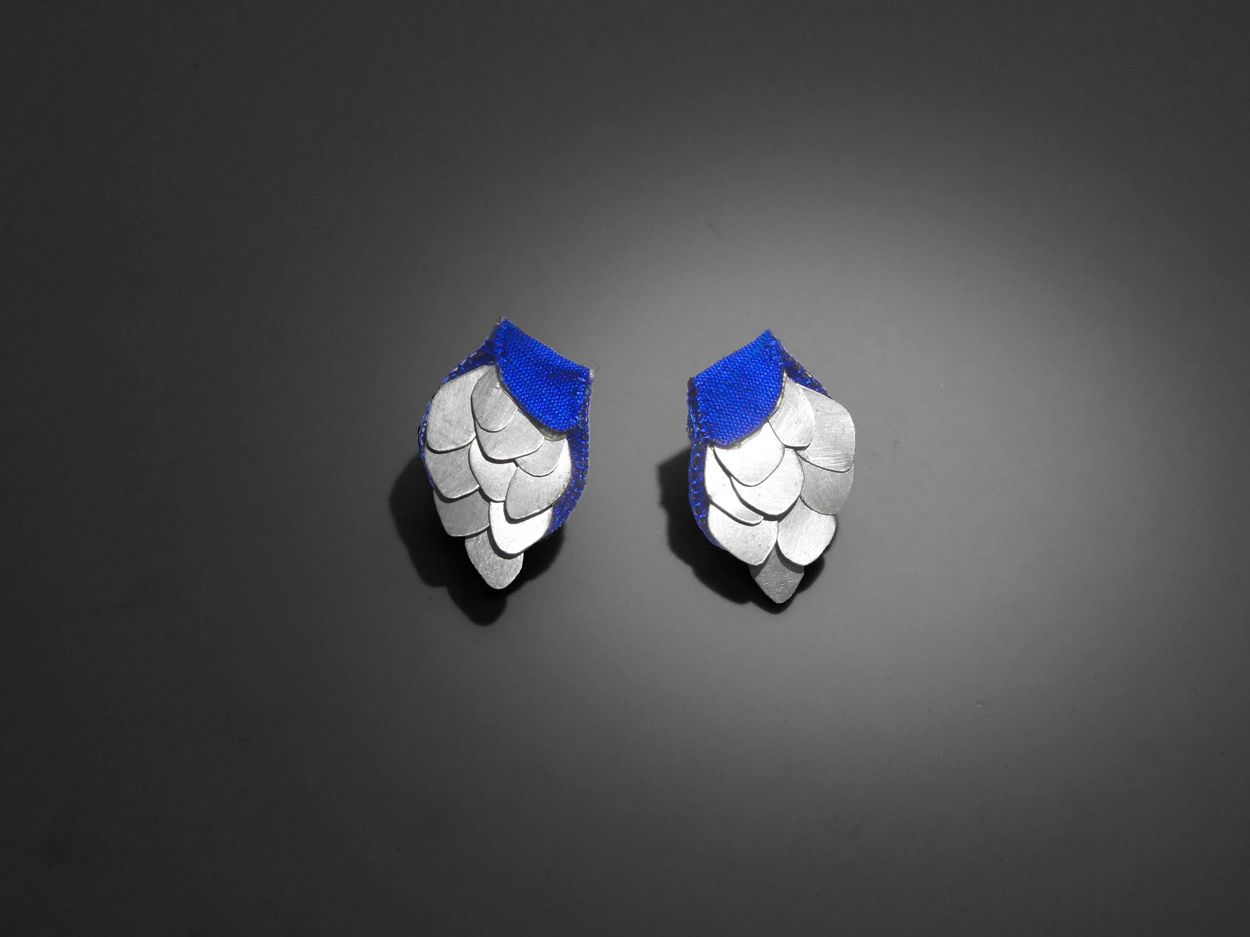 Handcrafted silver and raw silk earrings with floral inspiration