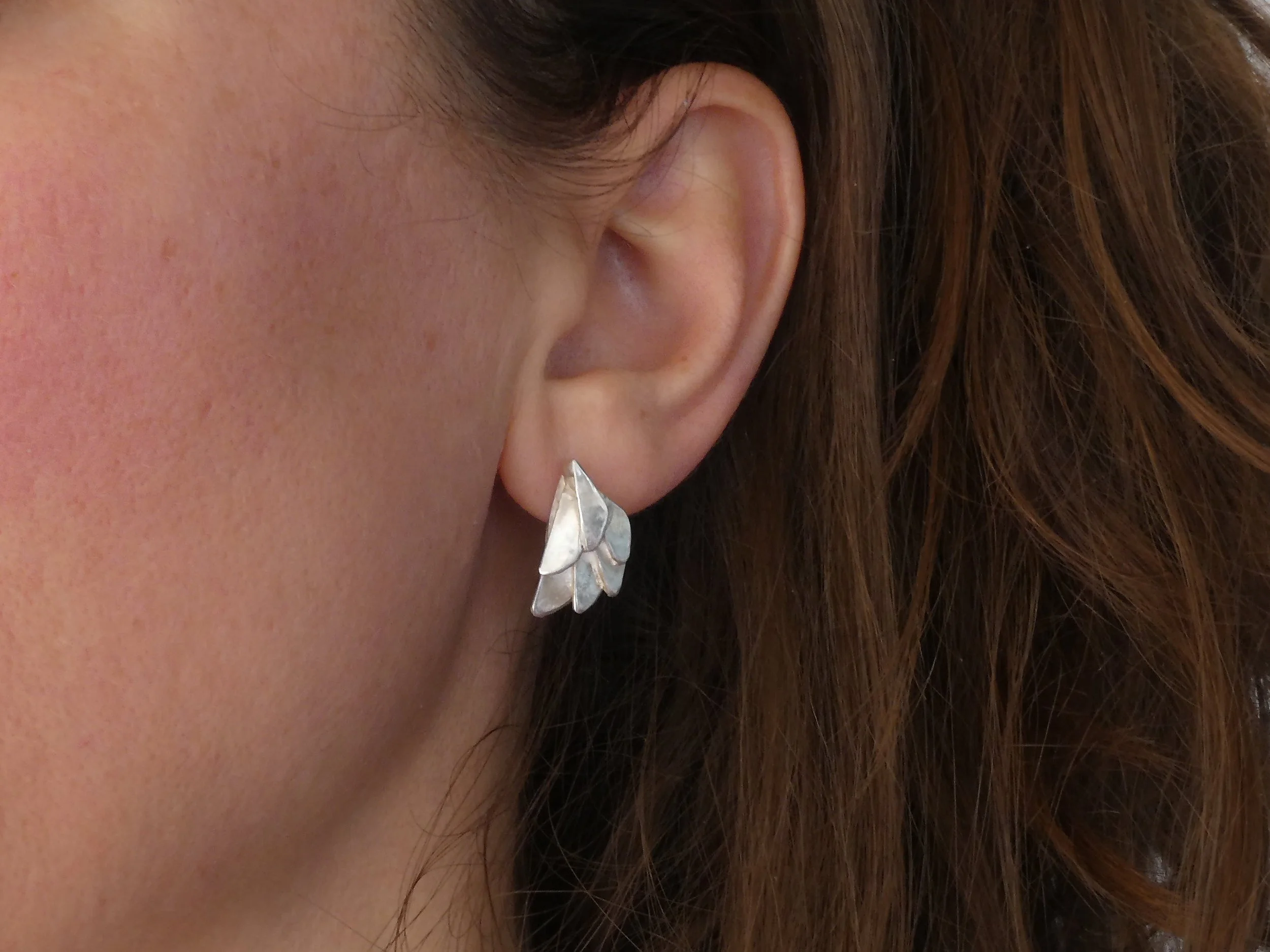 Earwings – Silver Wings for Your Ears: Minimalist silver wing earrings handmade in Switzerland, contemporary jewelry with a delicate and lightweight design