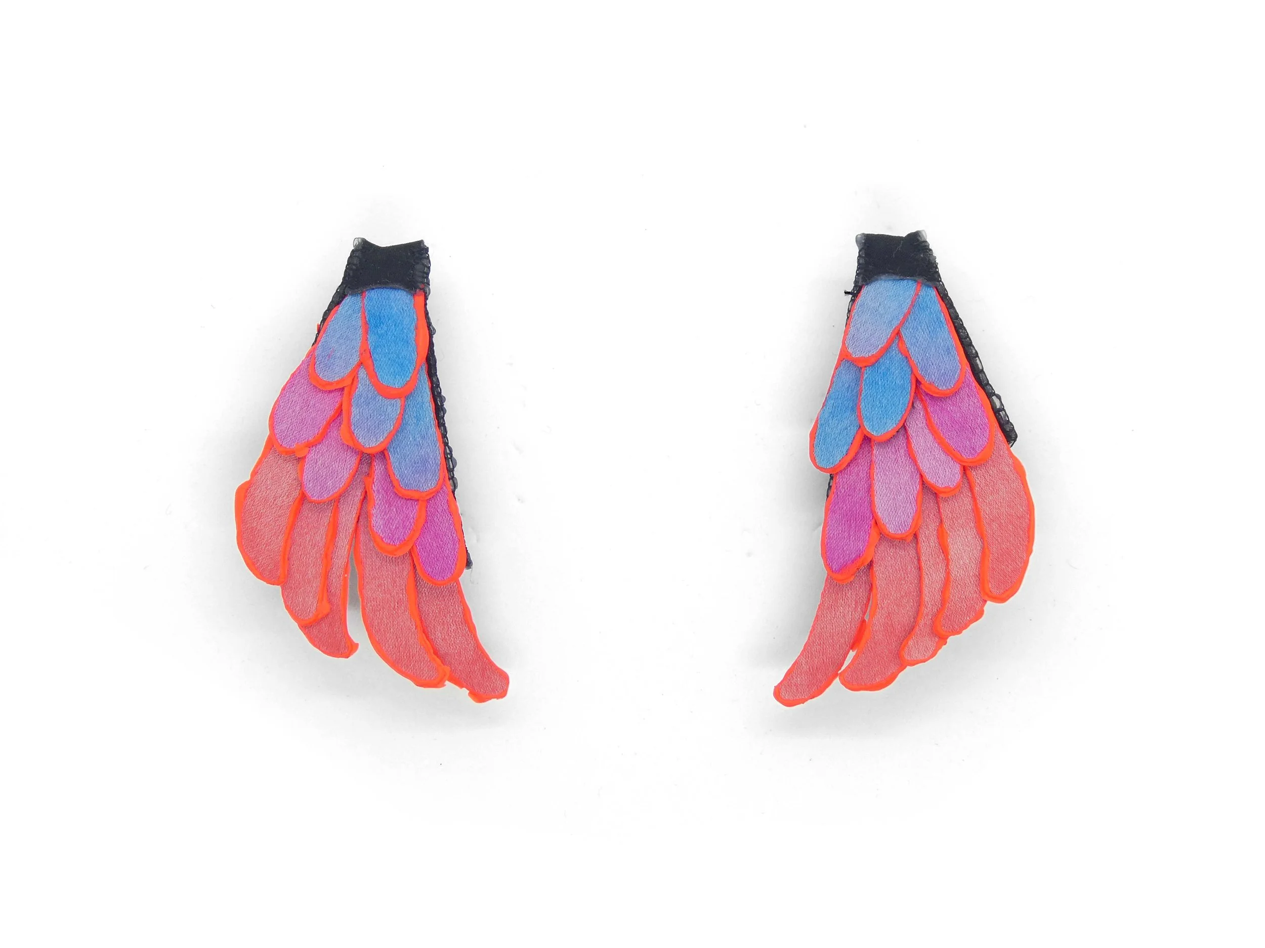 Art jewelry piece by Julie Usel, iridescent pink and blue tones, handmade in Switzerland
