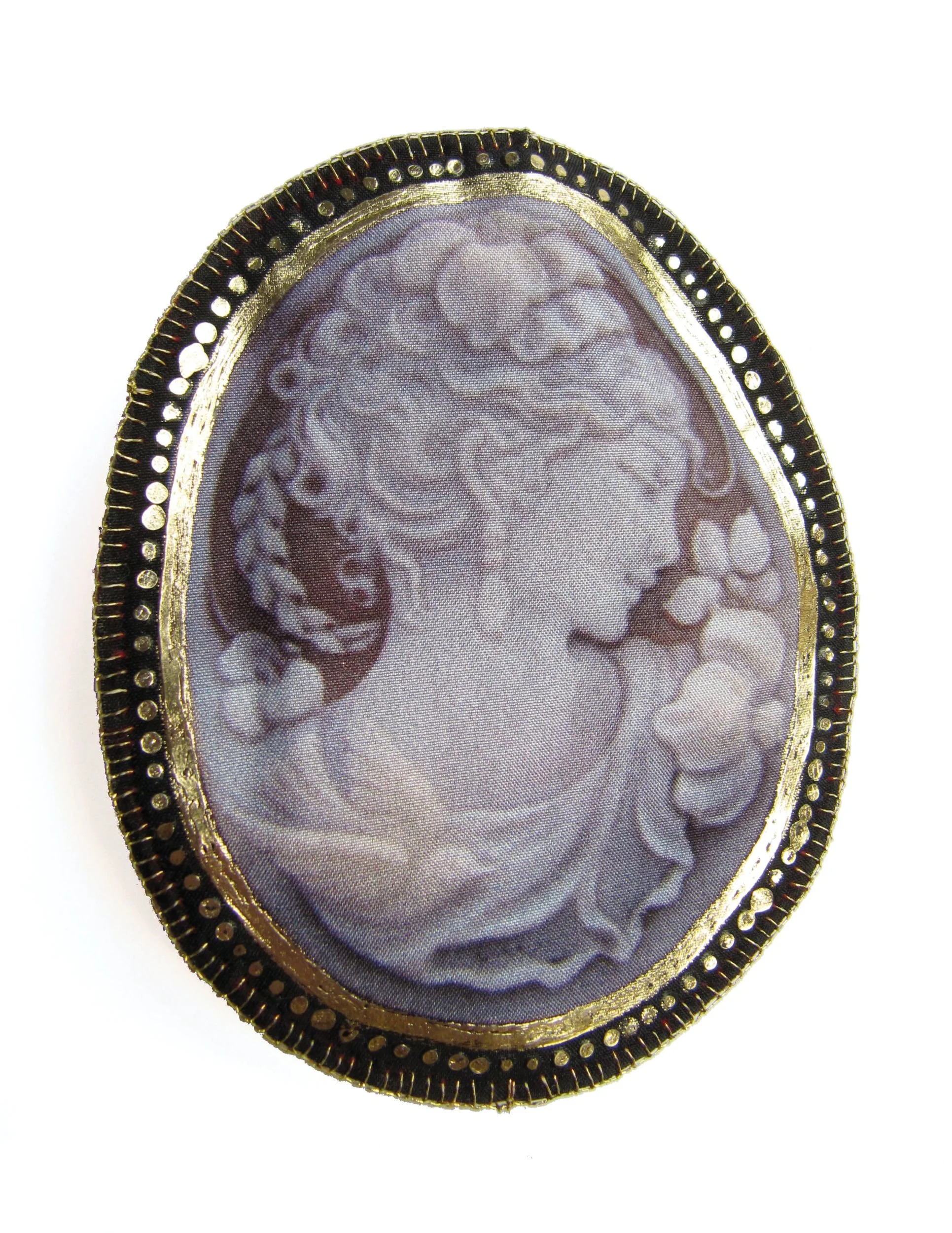 Cameo: printed silk, gold leaf, metal brooch