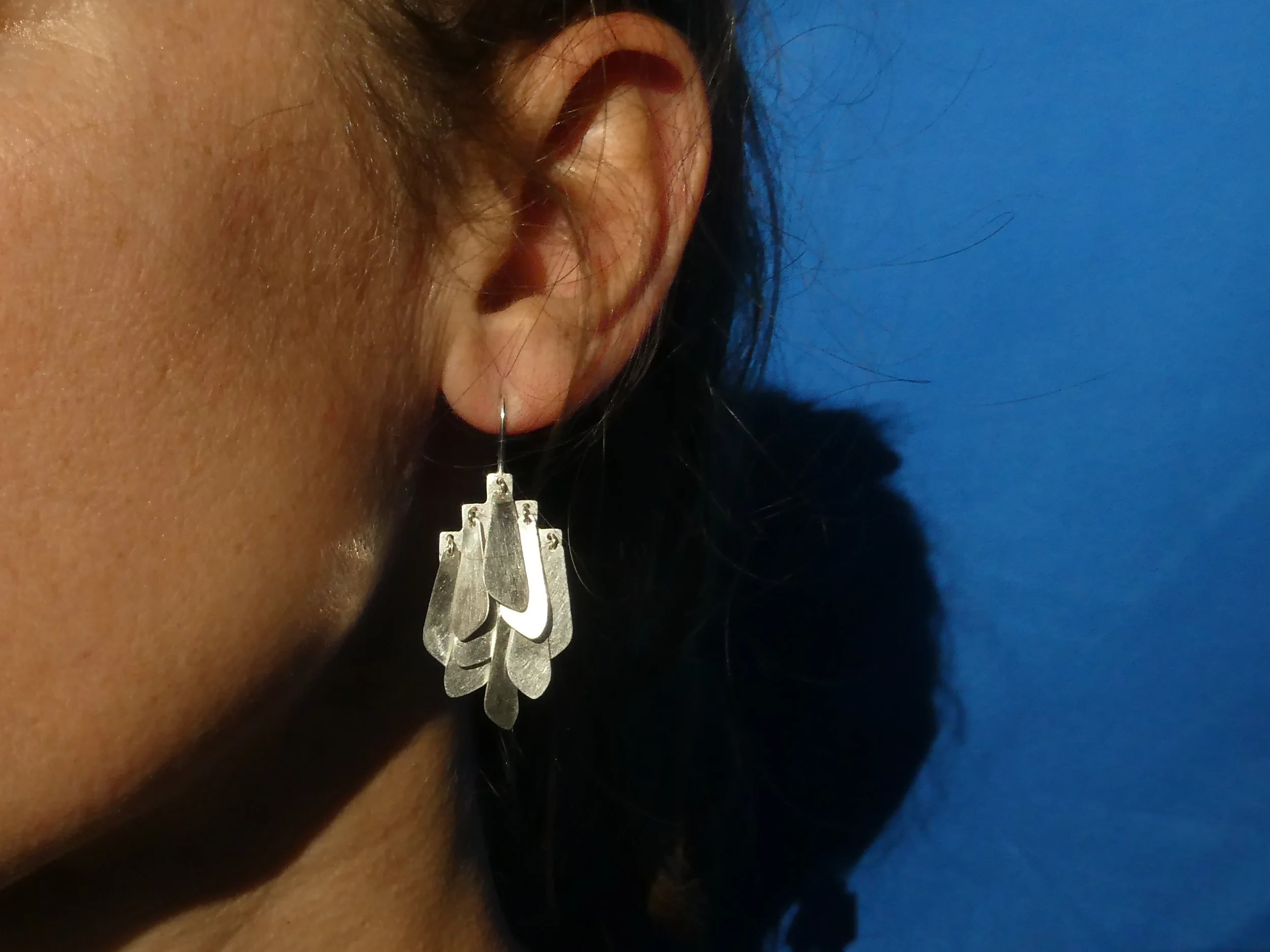 Handcrafted silver earrings with softly moving components