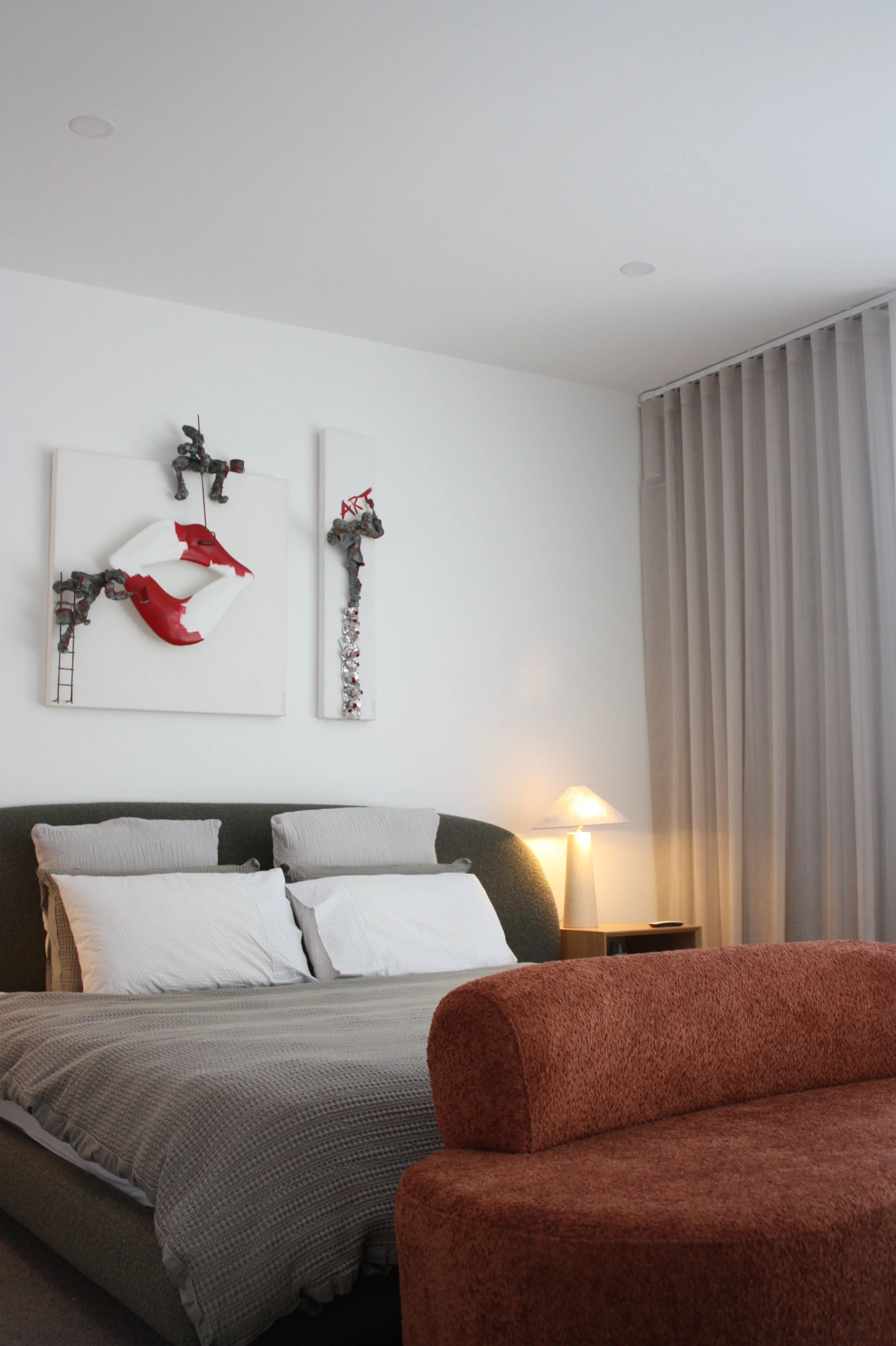 Serpells Place Apartment Templestowe master bedroom designed in a MCM style with features of orange and green with automated window furnishings