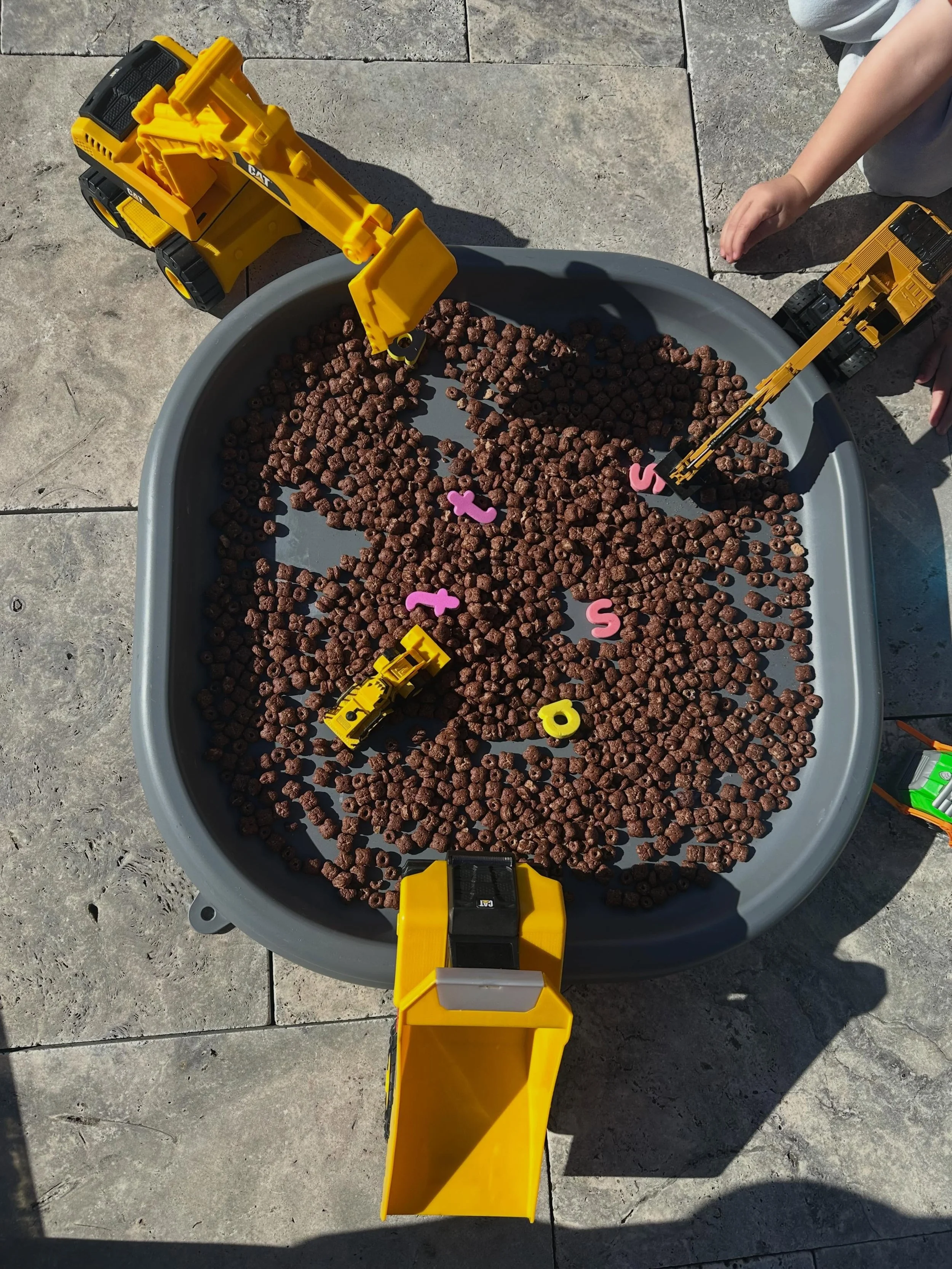 Today&rsquo;s setup for my 2.5 year old - construction trucks, cereal and a few foam letters. Happy chaos and sneaky learning. 

I&rsquo;m casually introducing /s/ /a/ /t/ at the moment because, at this age (and any age really), interest-based is the