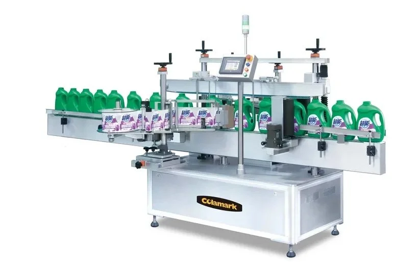 Automated liquid detergent bottle labeling machine with green detergent bottles and label application.