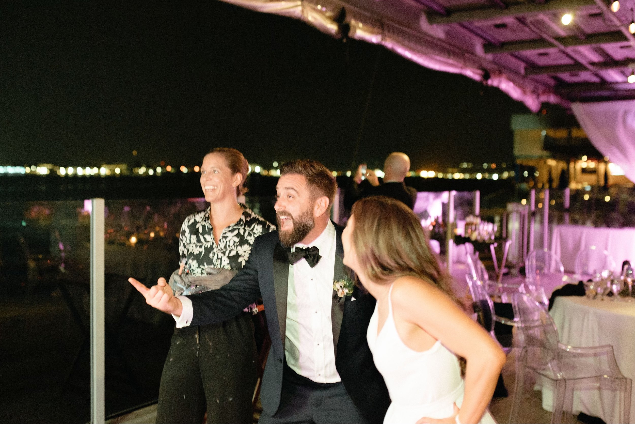 Groom's surprised and happy face when he see's their painting for the first time.