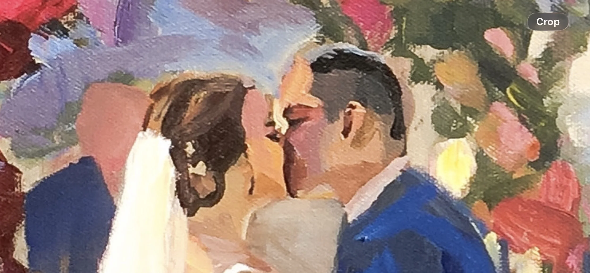 close up of a live wedding painting showing faces with patches of color