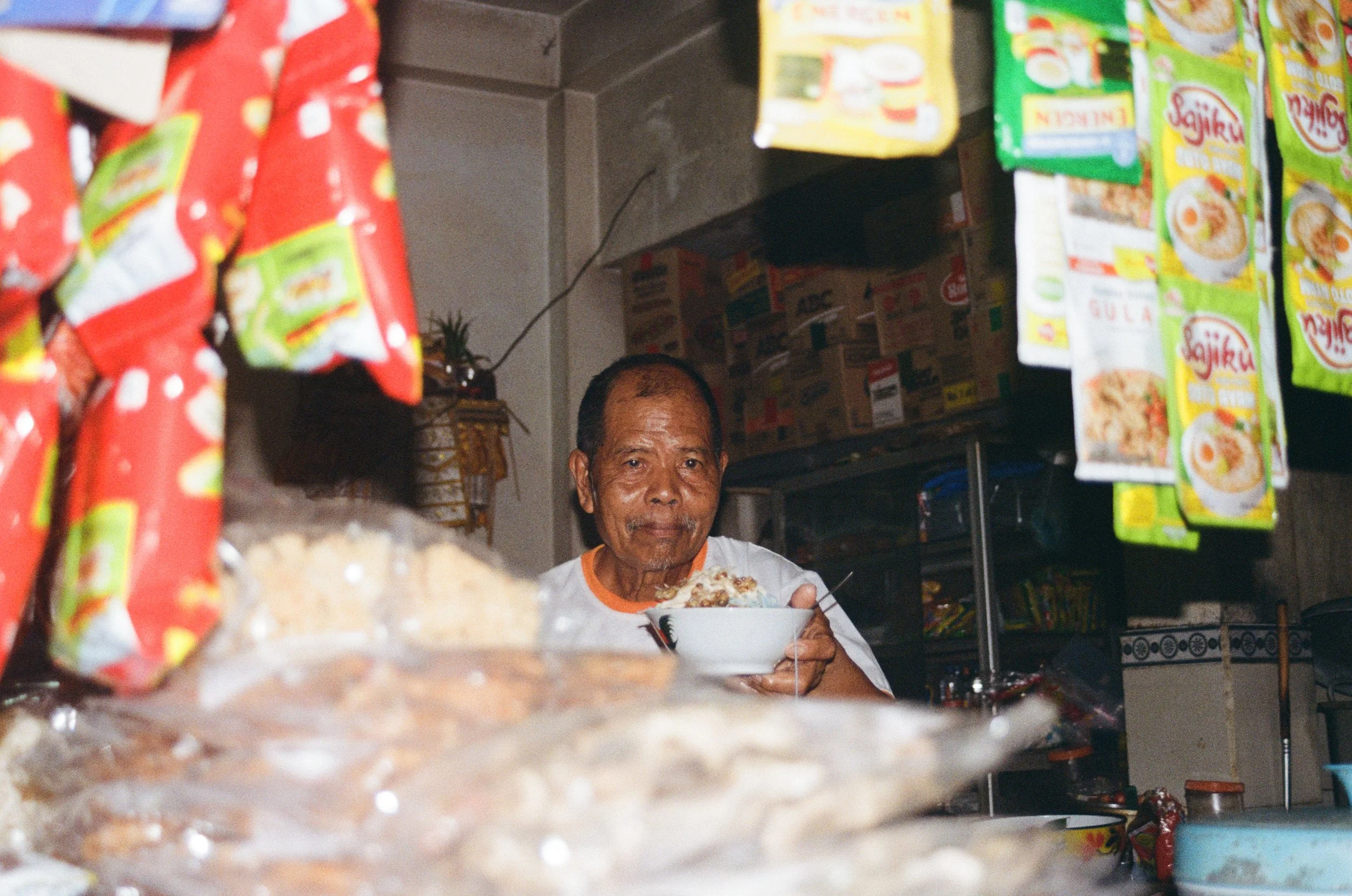balinese man serving soup