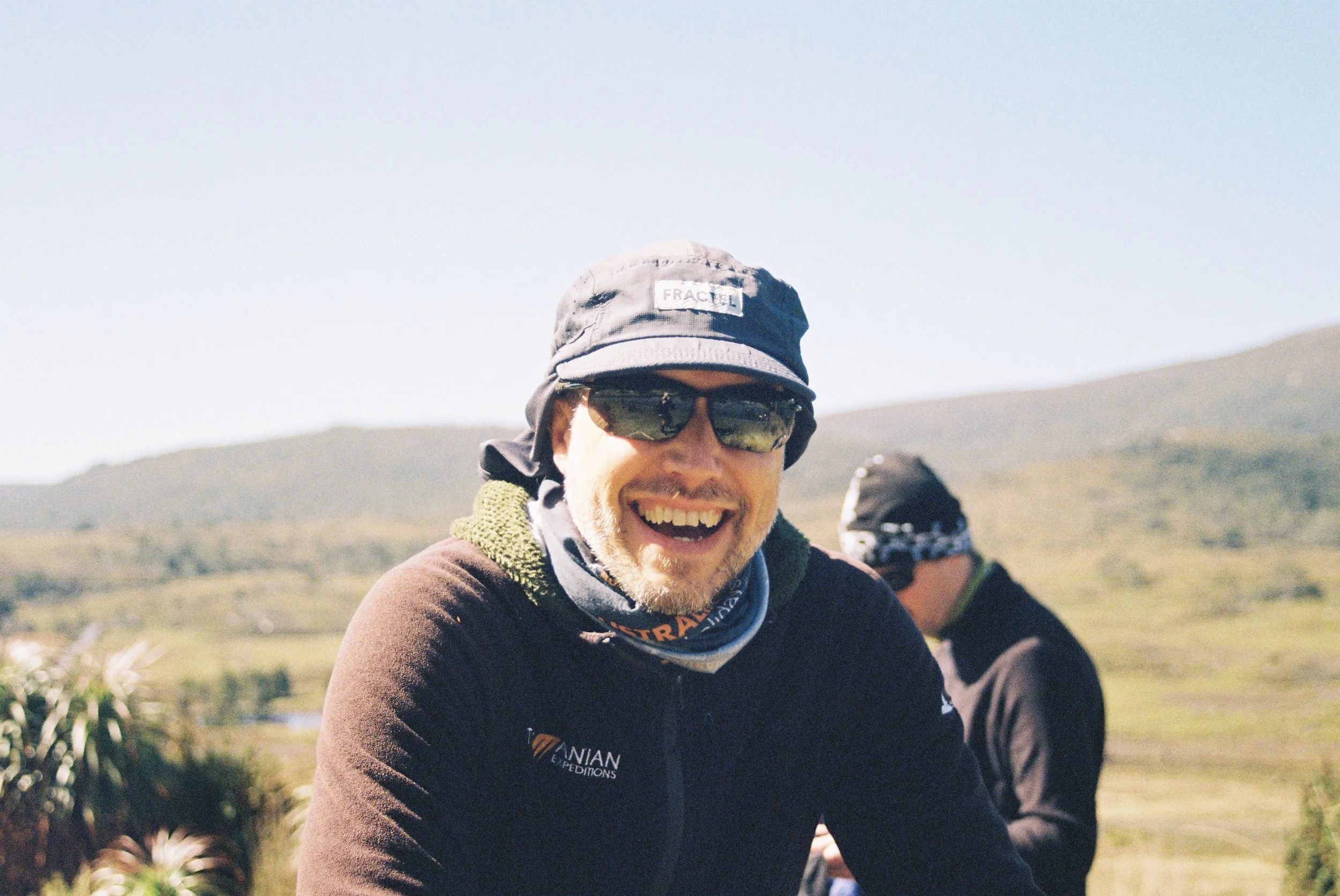 Guide on the overland track in Tasmania, laughing.