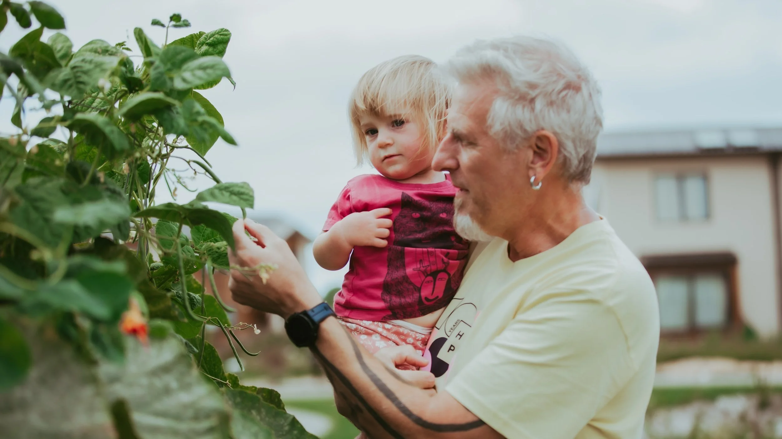Resident Don Smith sharing the magic of gardening with the younger generation..jpg