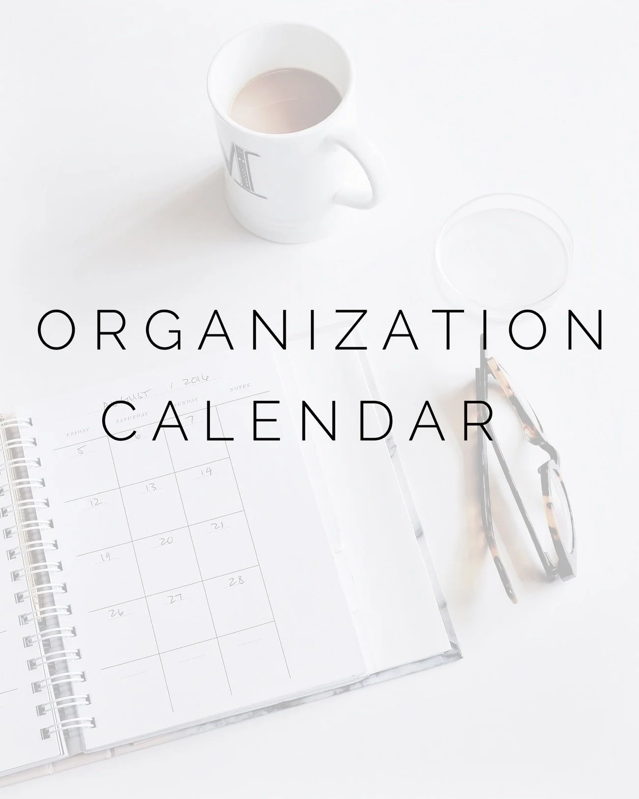 Open planner and mug on desk with overlay text "organization calendar".