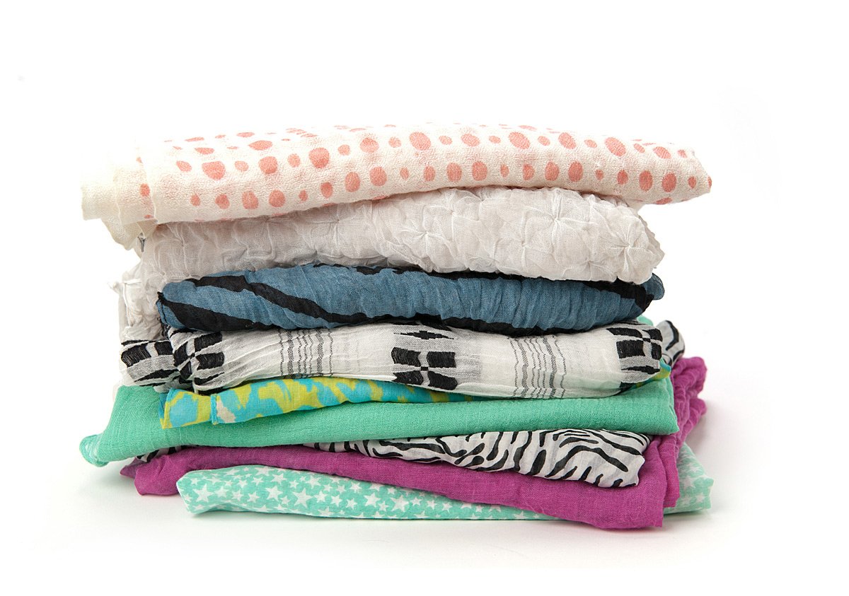 Stack of neatly folded clothes arranged in a pile.