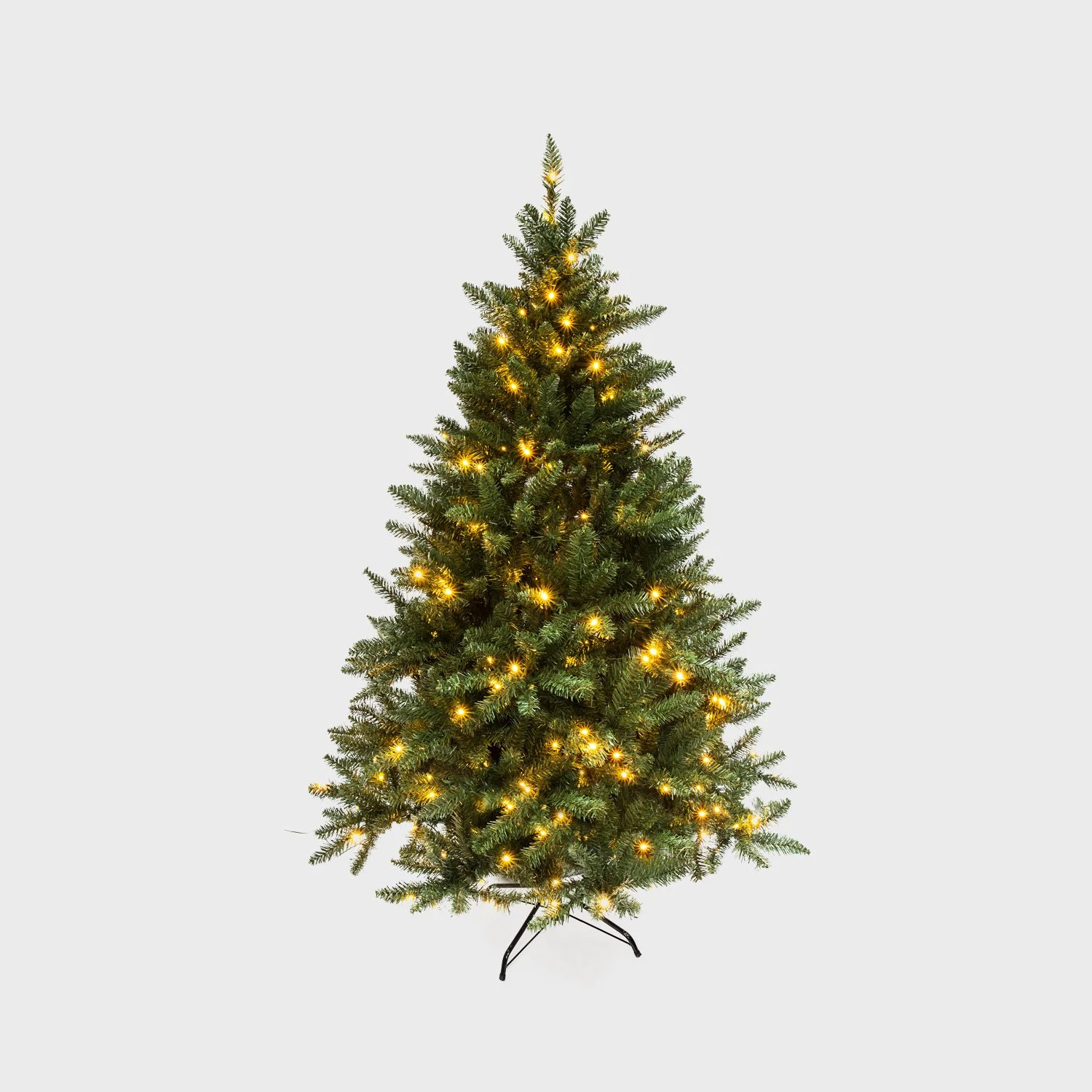 Artificial Christmas tree with warm white lights on a neutral background.