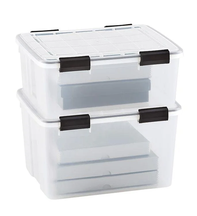 Clear plastic storage bins stacked with lids.